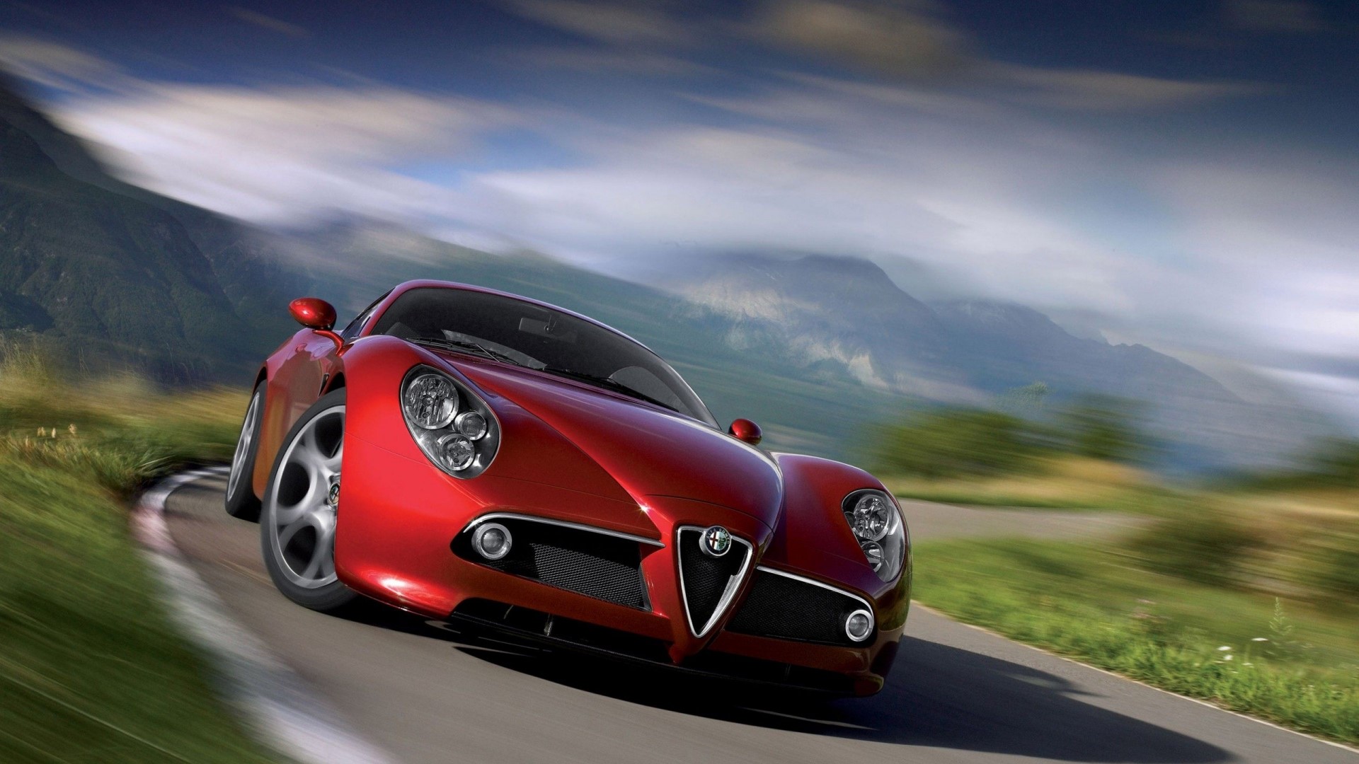 Red Alfa Romeo 8C Competizione on a mountain road HD Wallpaper