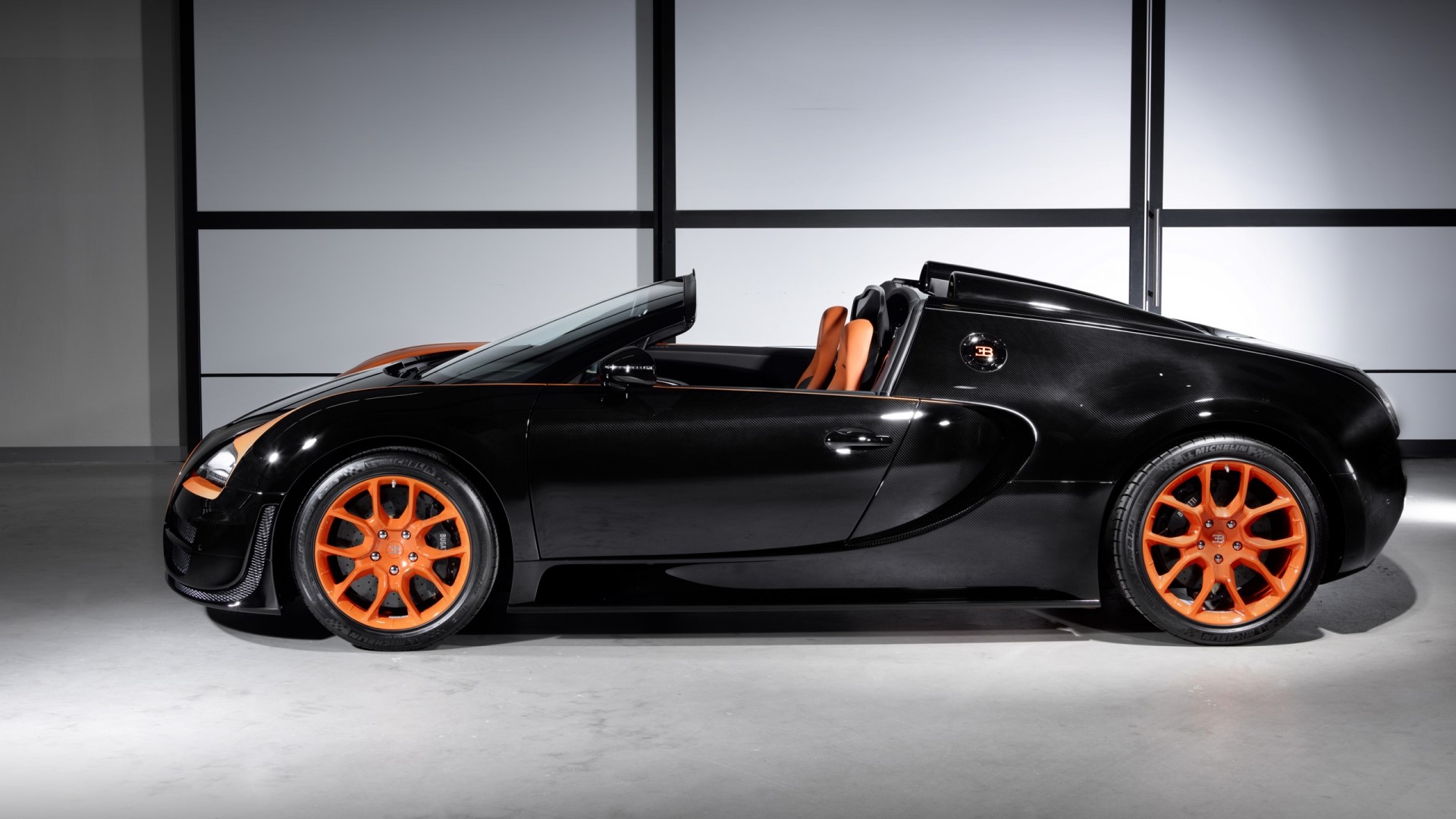 Black Bugatti Veyron Roadster with Orange Accents HD Wallpaper