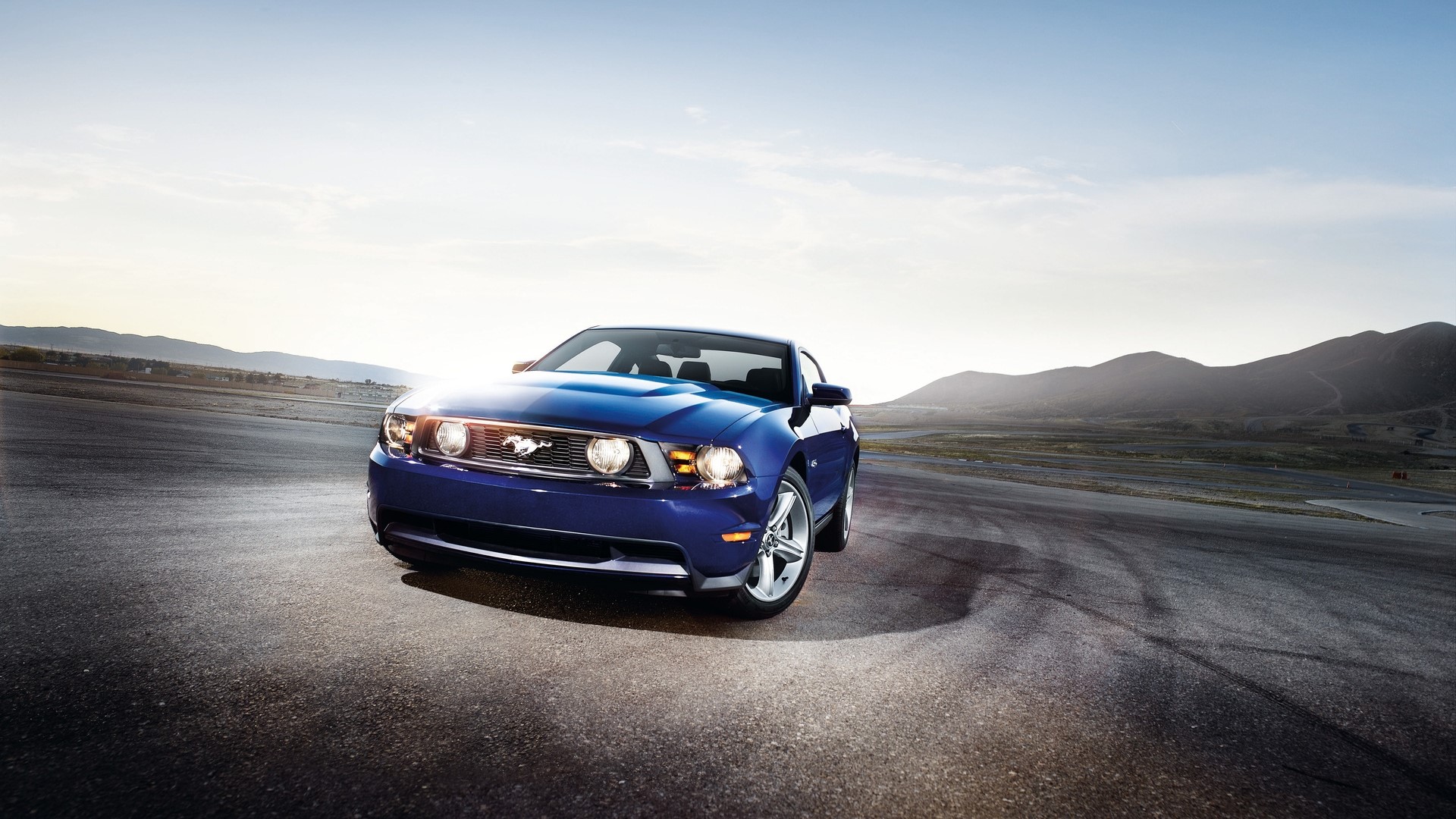Blue Ford Mustang on a Racetrack HD Wallpaper