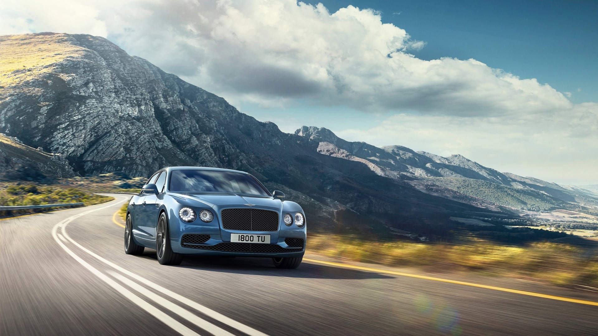 Bentley Flying Spur W12 S on a mountain road HD Wallpaper