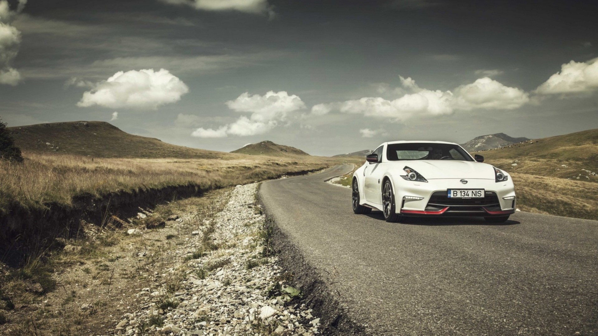 White Nissan 370Z on a winding road HD Wallpaper