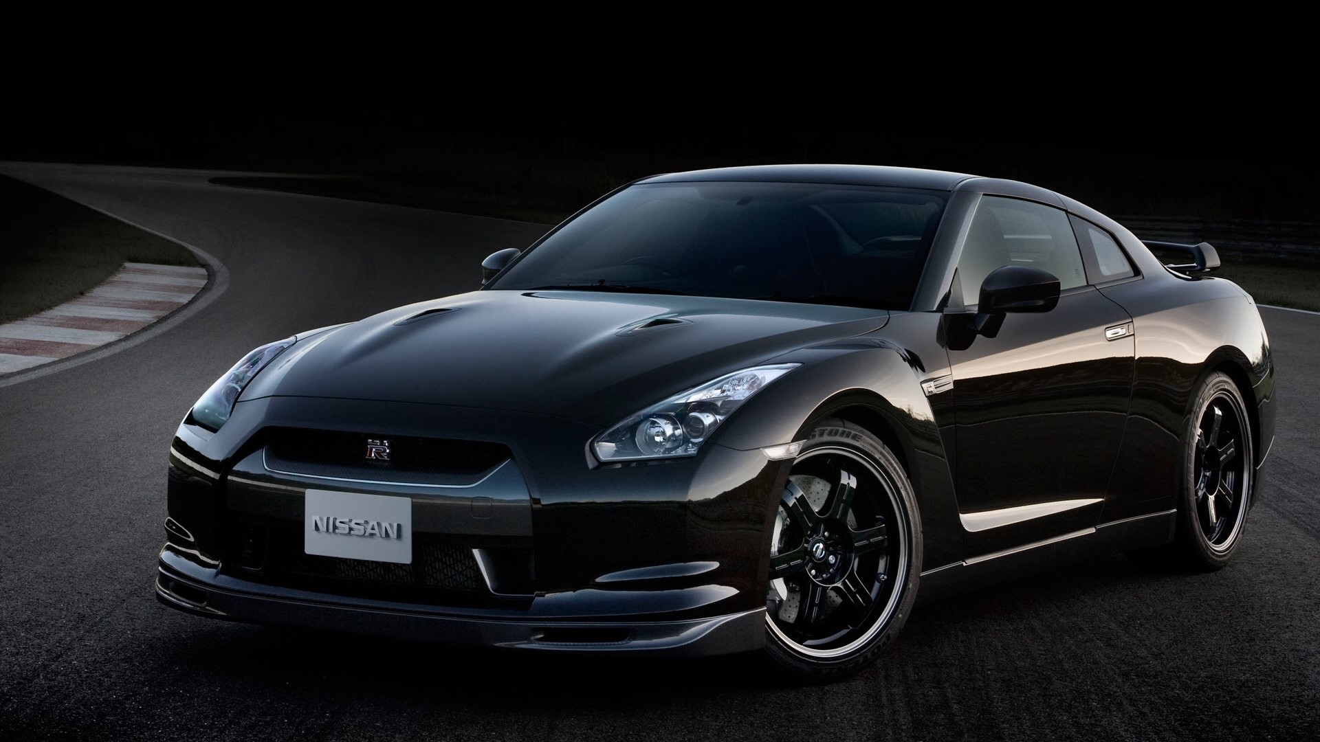 Black Nissan GT-R Spec V on a Racetrack HD Wallpaper