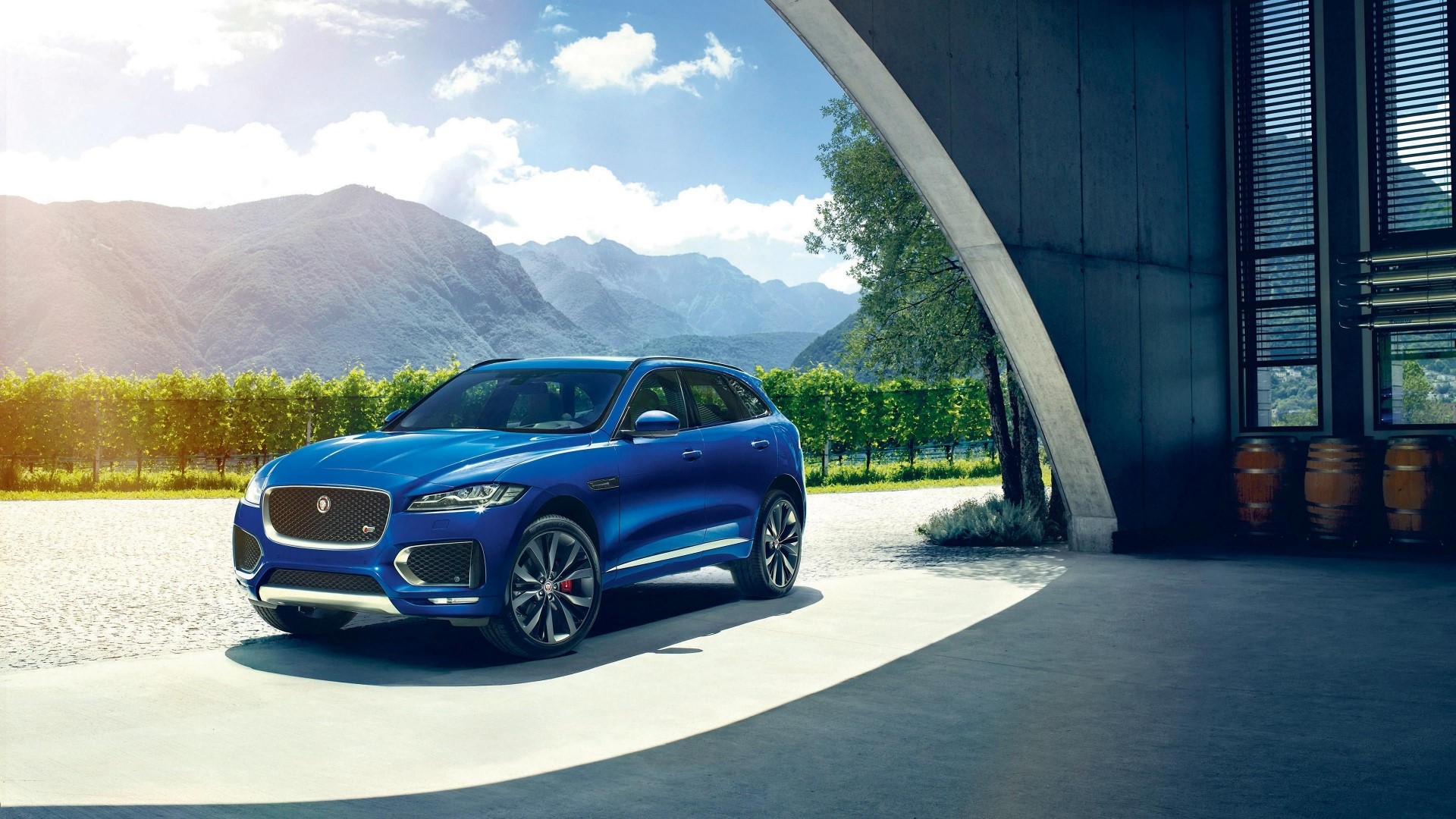 Blue Jaguar F-Pace SUV parked outdoors HD Wallpaper