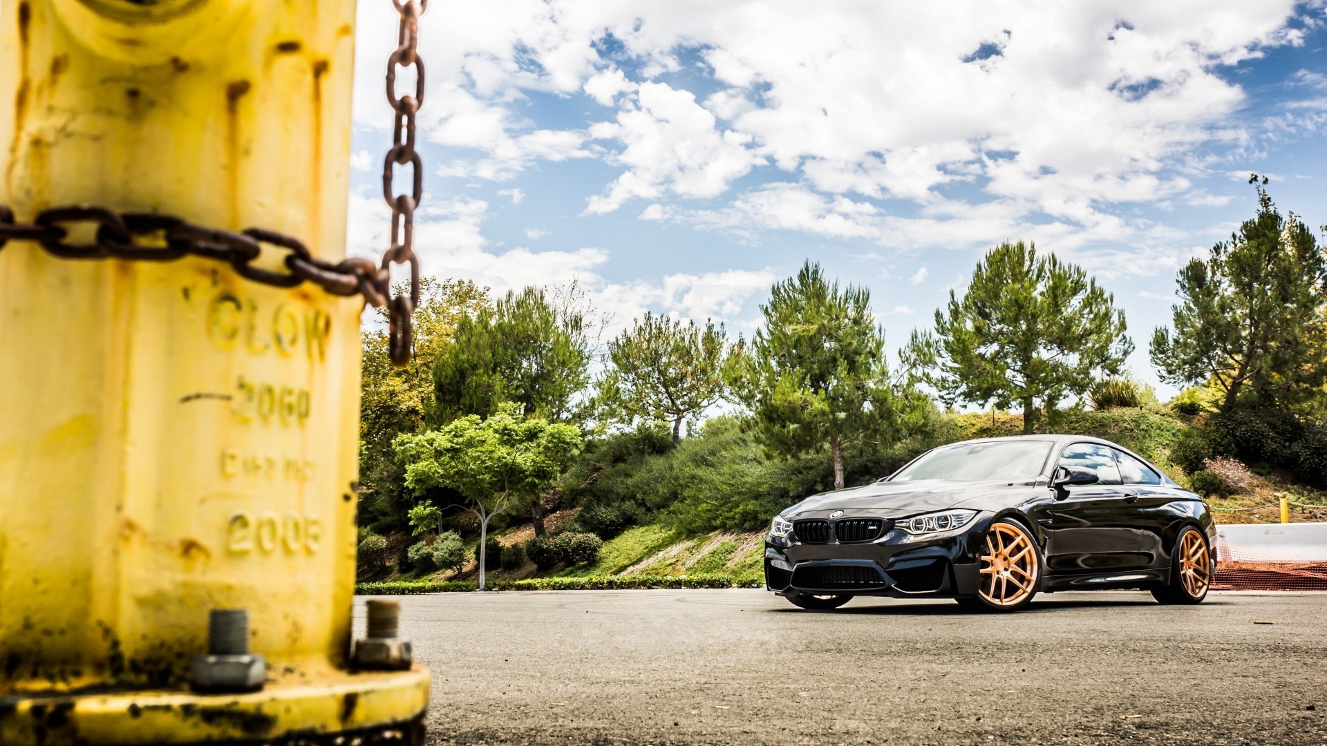 Black BMW M4 Coupe with gold rims HD Wallpaper