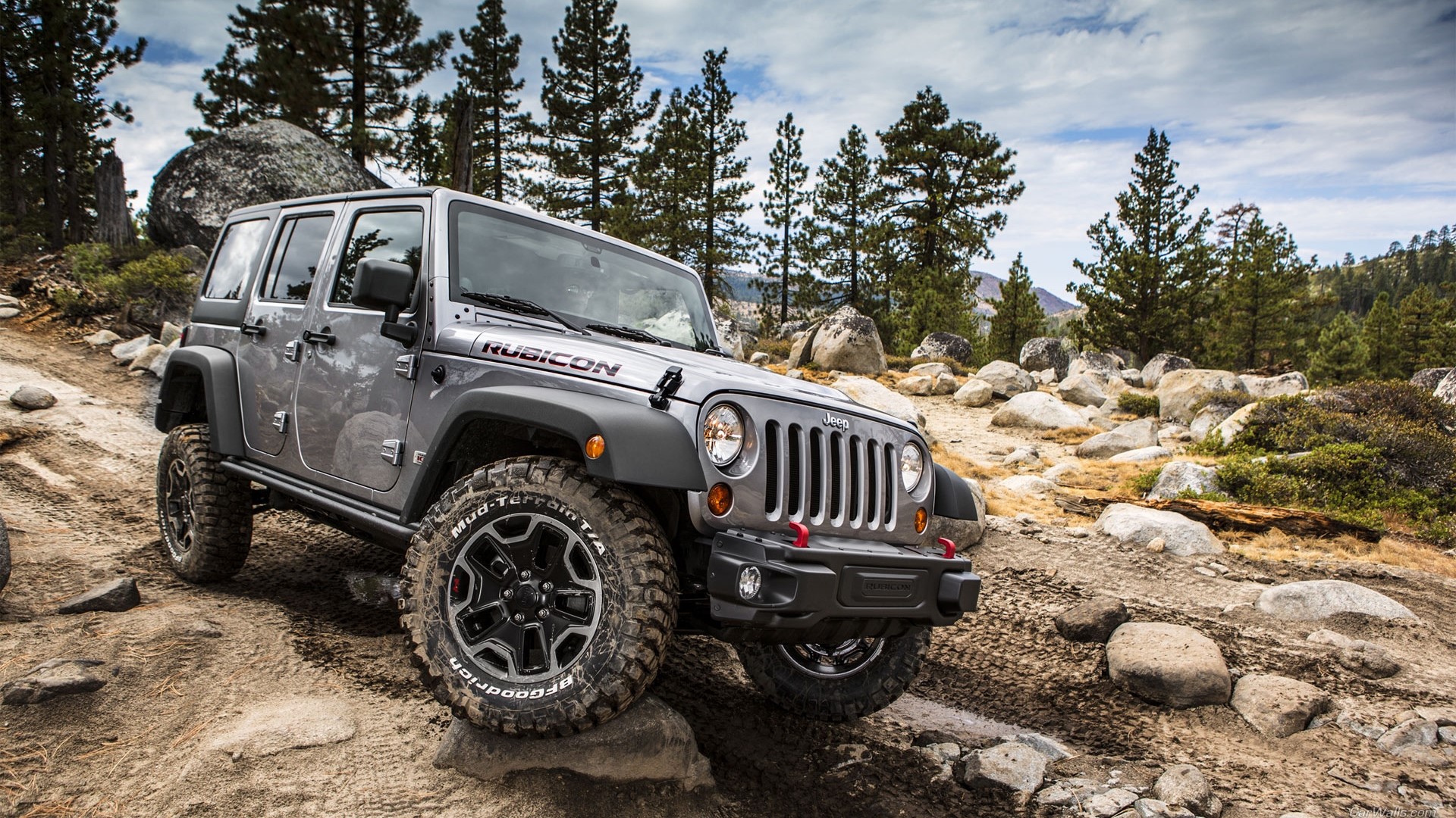 Jeep Wrangler Rubicon off-roading on rocky terrain HD Wallpaper