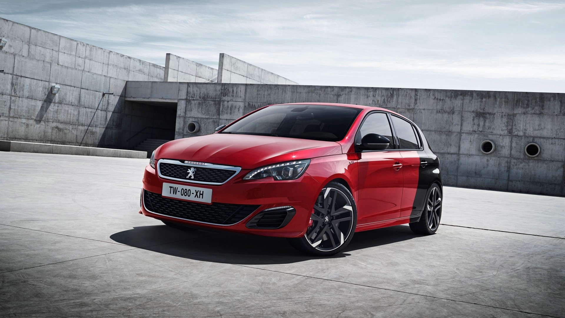 Red Peugeot 308 GTI parked on concrete HD Wallpaper