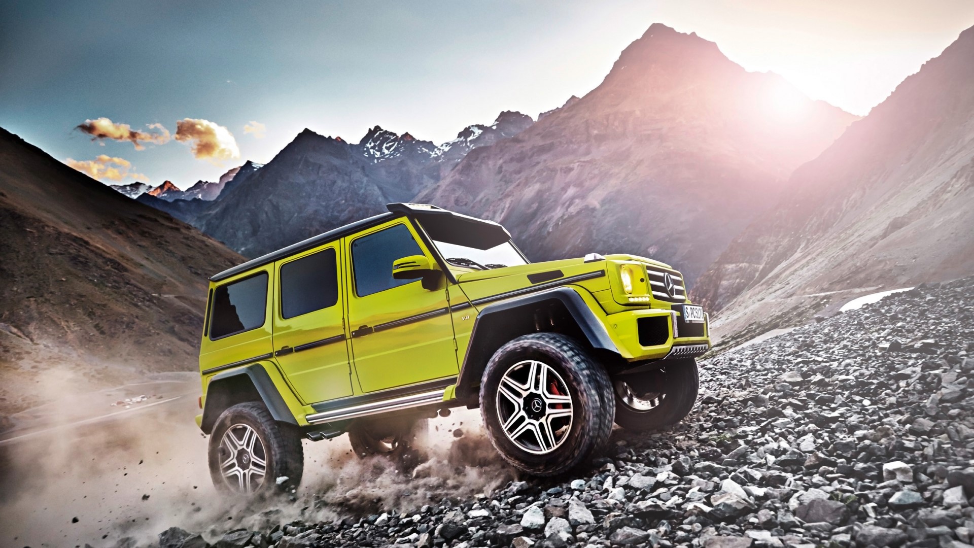 Yellow Mercedes-Benz G500 4x4 driving on rocky mountain road HD Wallpaper