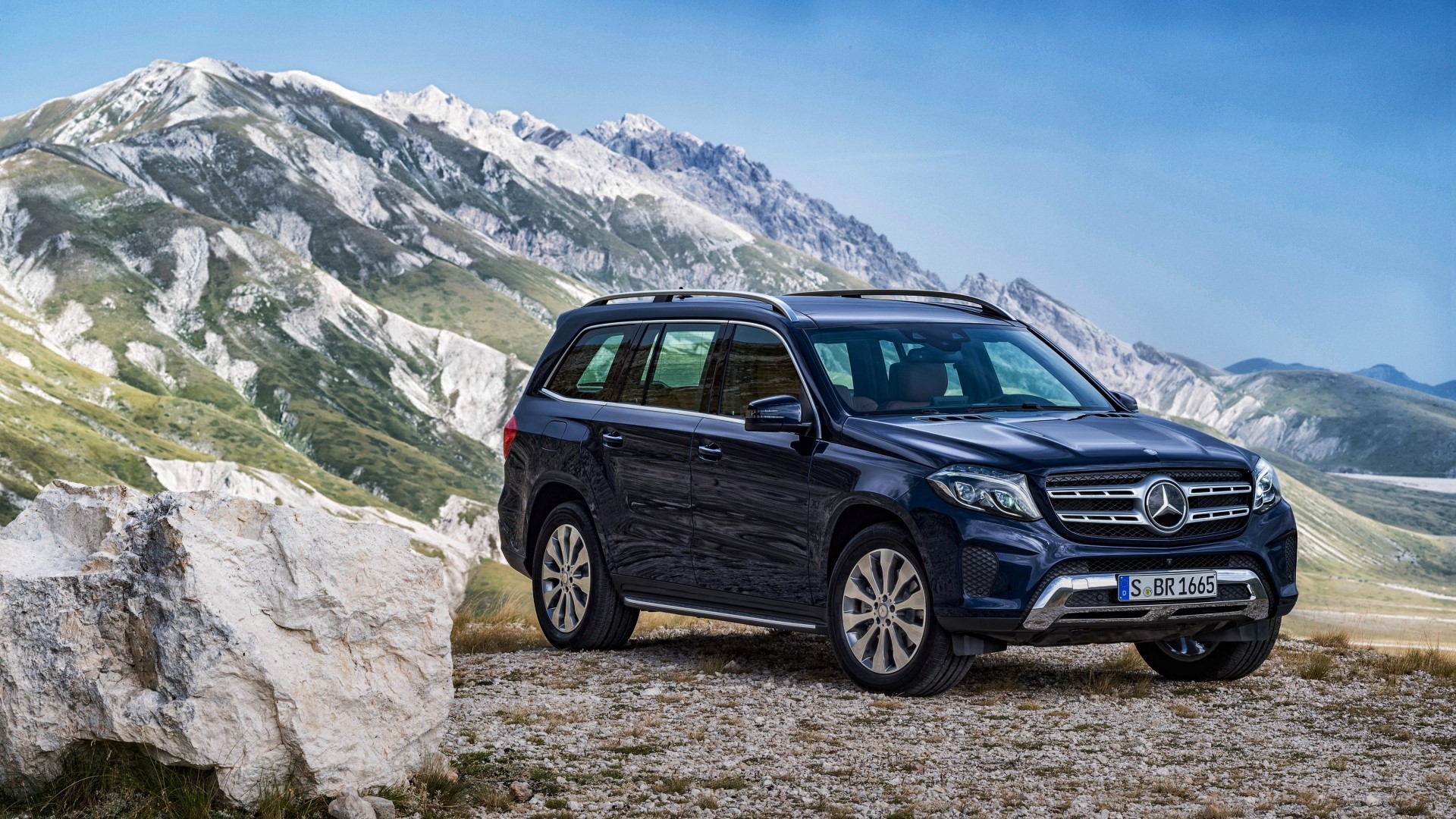 Mercedes-Benz GLS SUV parked on a rocky mountain landscape HD Wallpaper