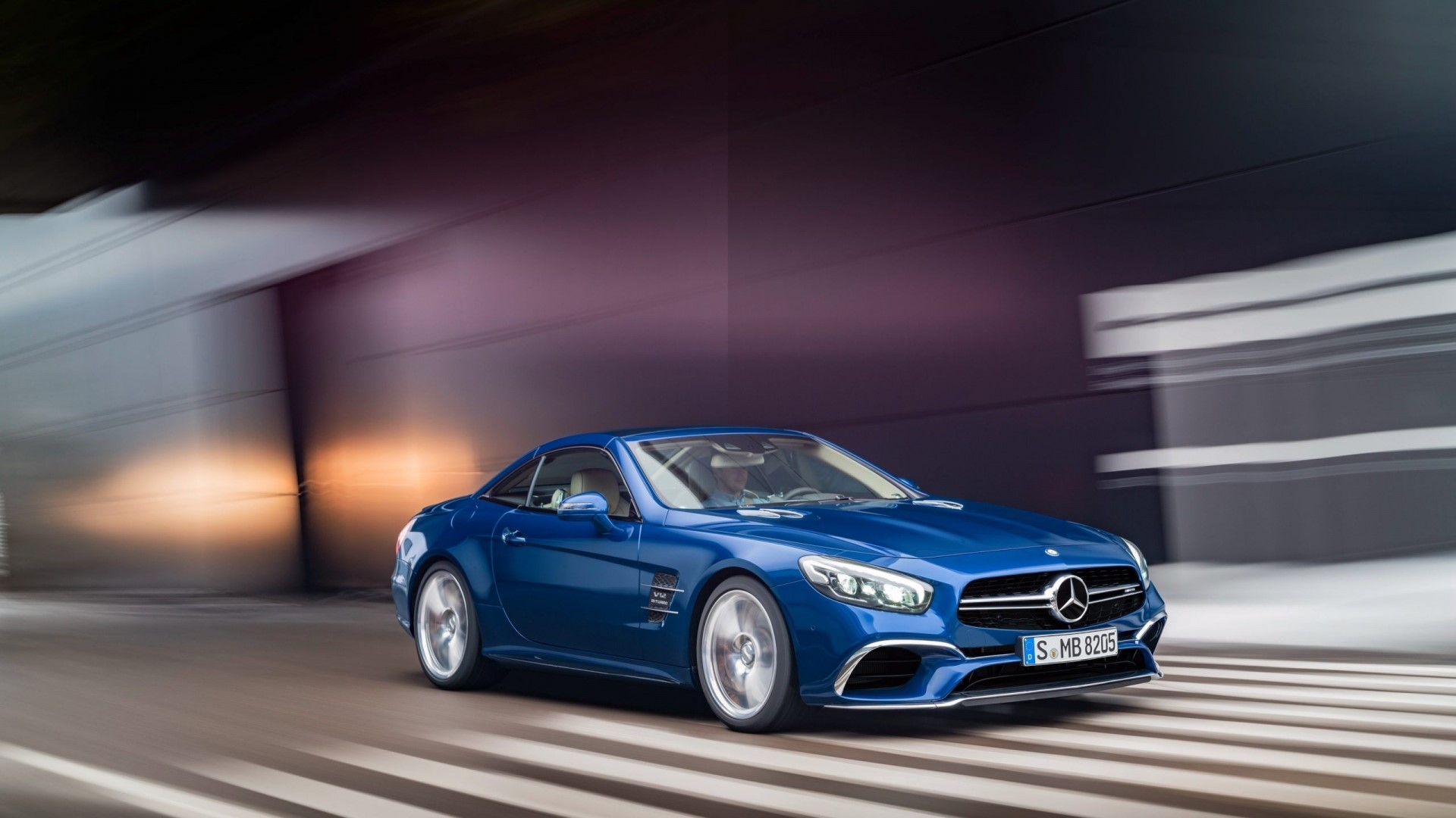 Blue Mercedes-Benz SL driving on a road HD Wallpaper