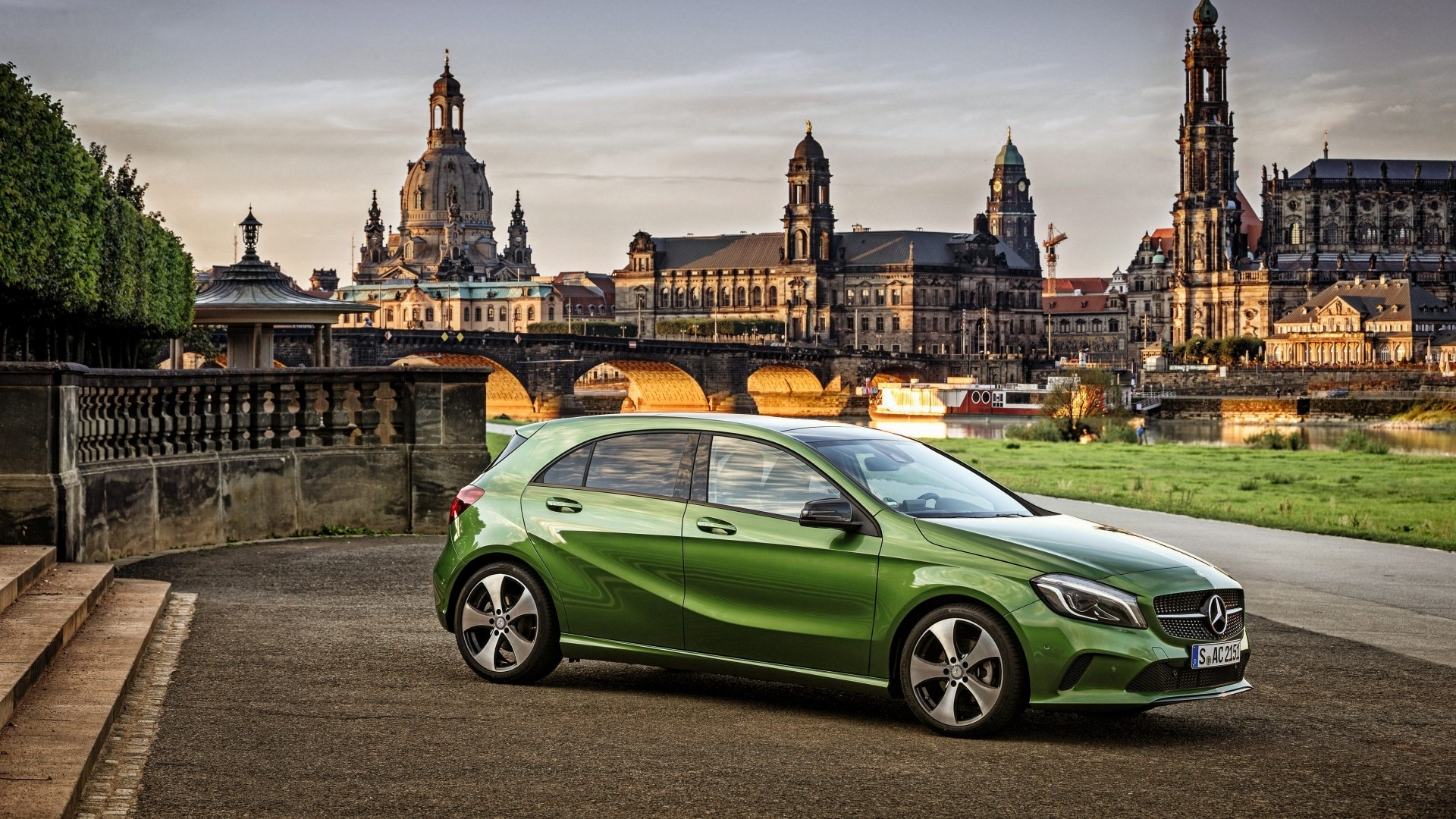 Green Mercedes-Benz A200 in front of Dresden cityscape HD Wallpaper