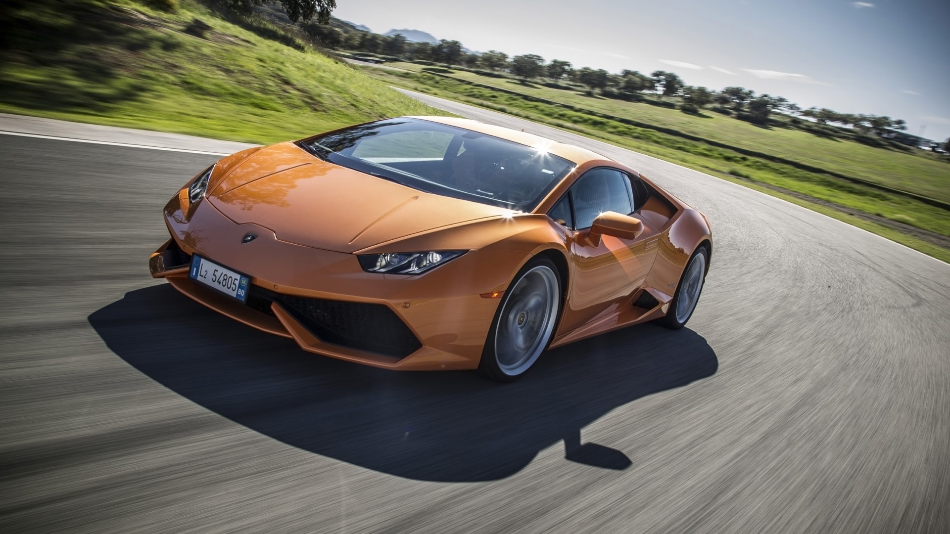 Orange Lamborghini Huracan Lp610 4 on a Racetrack HD Wallpaper