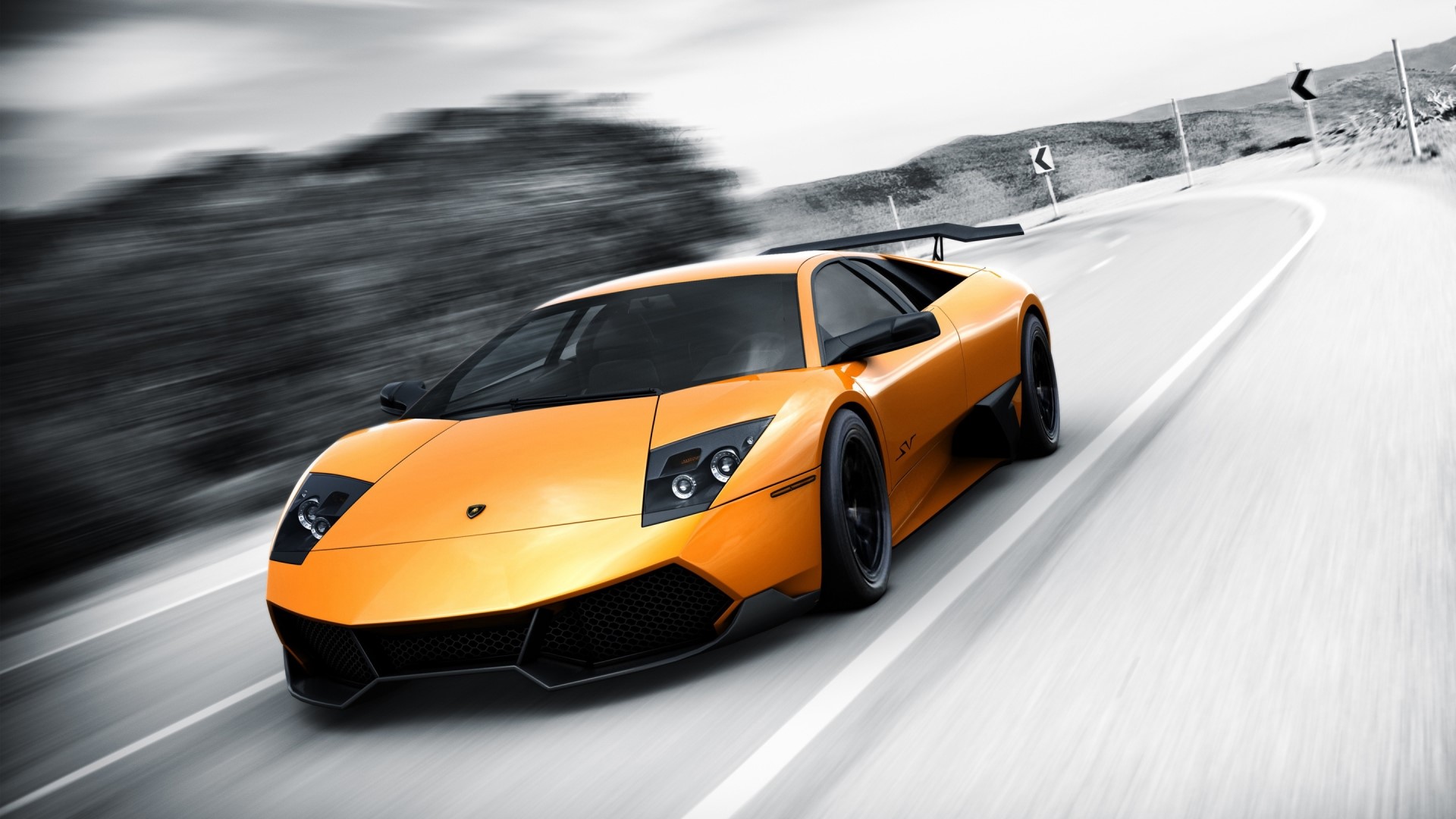 Orange Lamborghini Murcielago LP 670-4 on a winding road HD Wallpaper