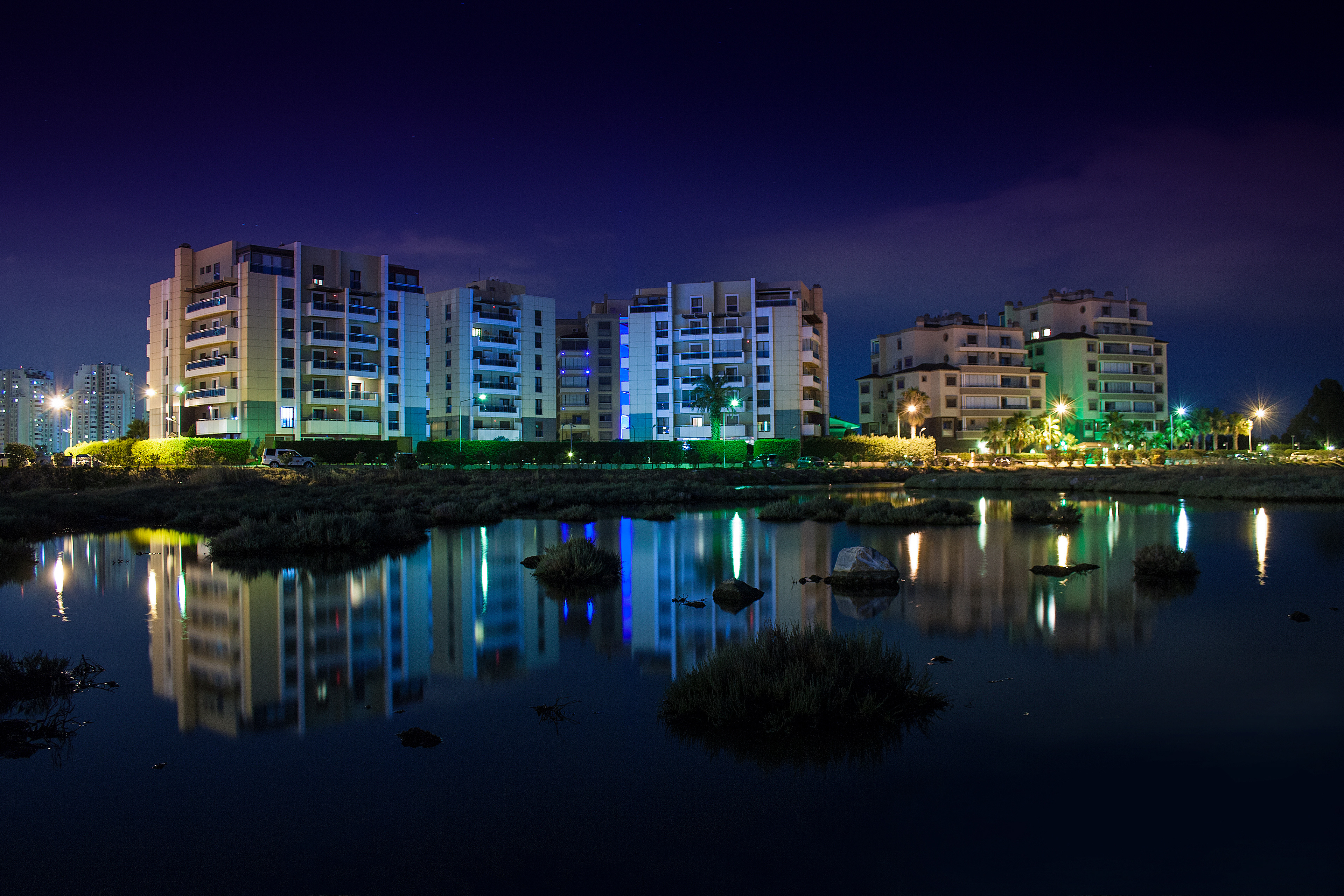 Apartment Buildings Reflected in Water at Night HD Wallpaper