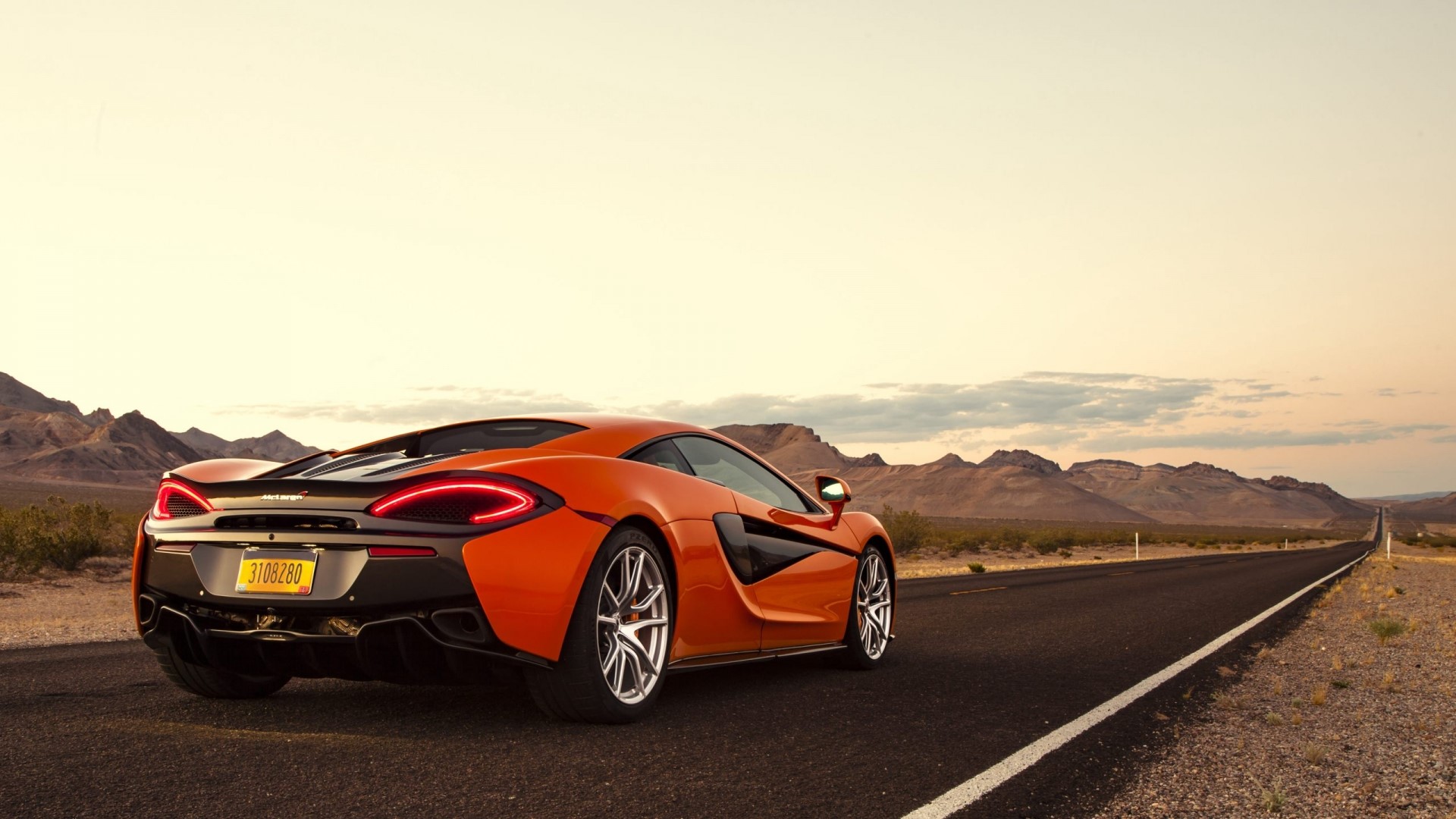 Orange McLaren 570S on a Desert Road HD Wallpaper