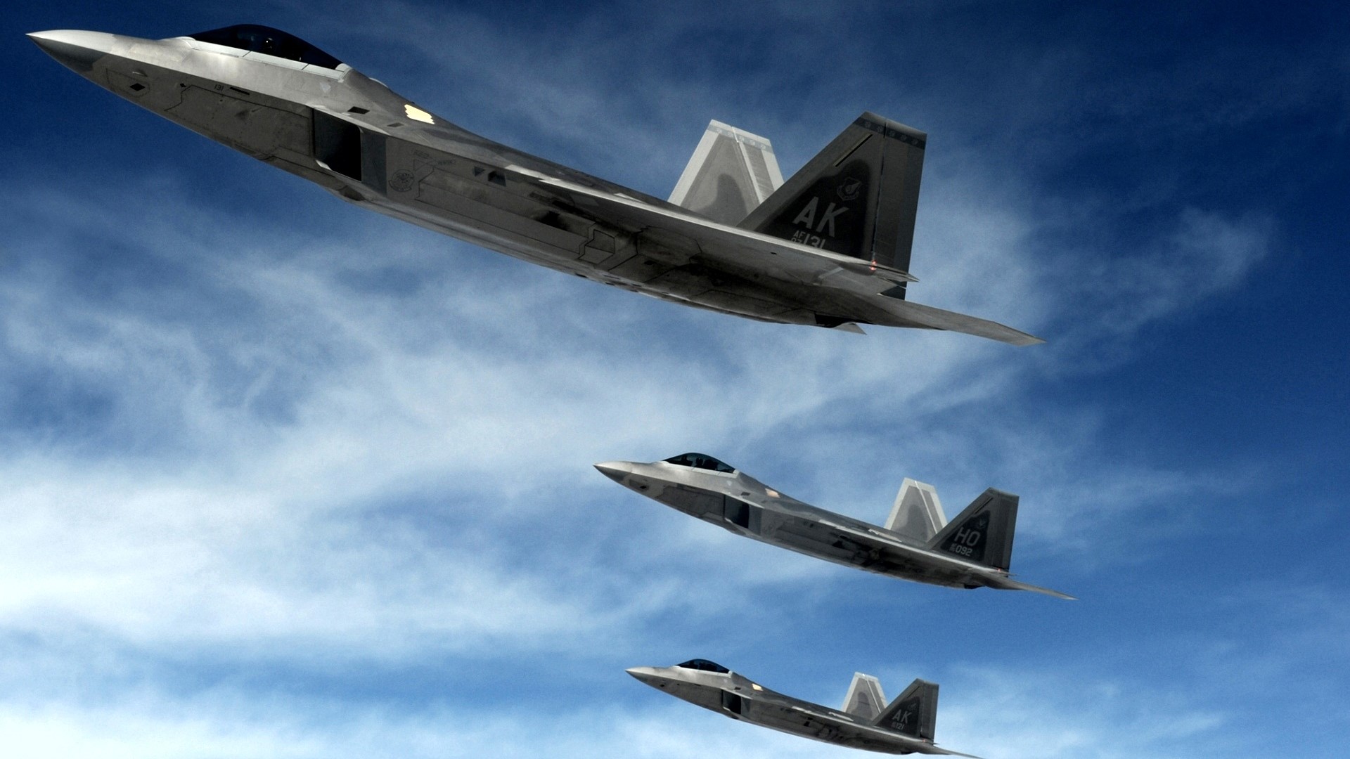 Three F-22 Raptors flying in formation HD Wallpaper