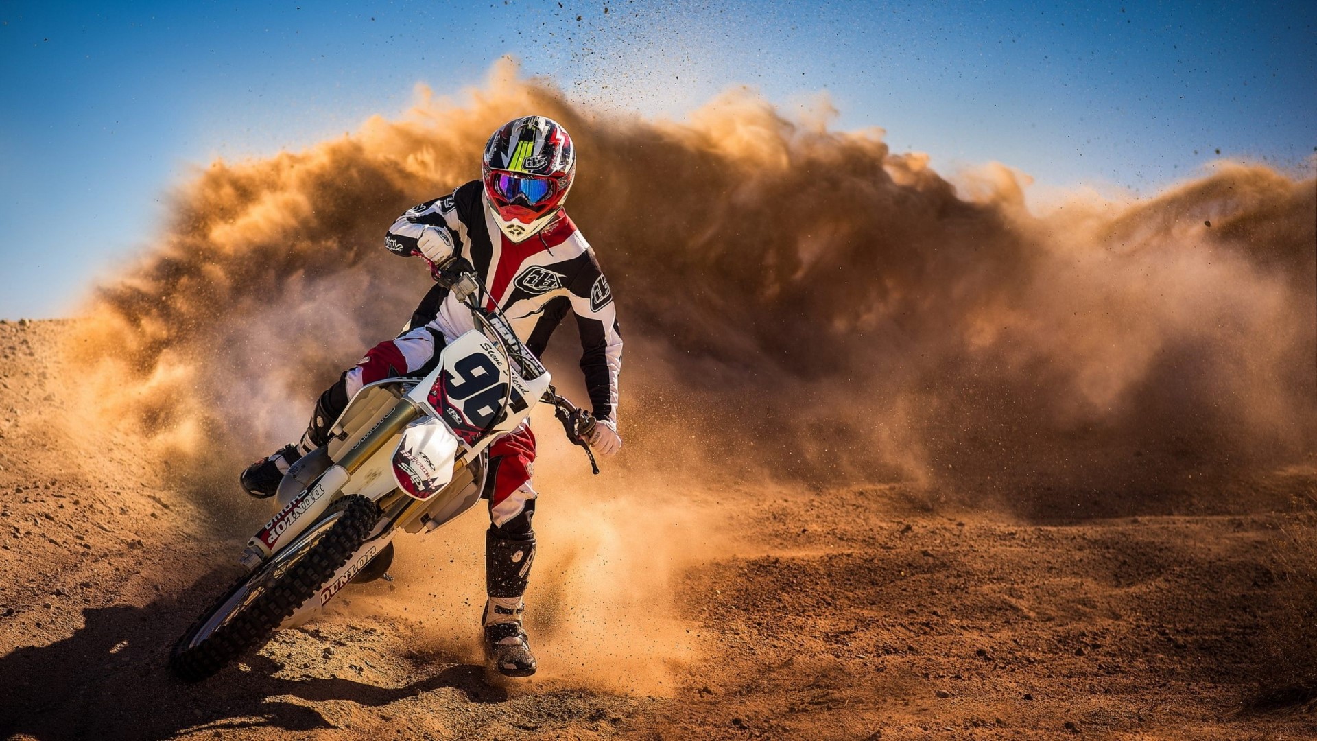 Motocross Rider Speeds Through Desert Dust Cloud HD Wallpaper