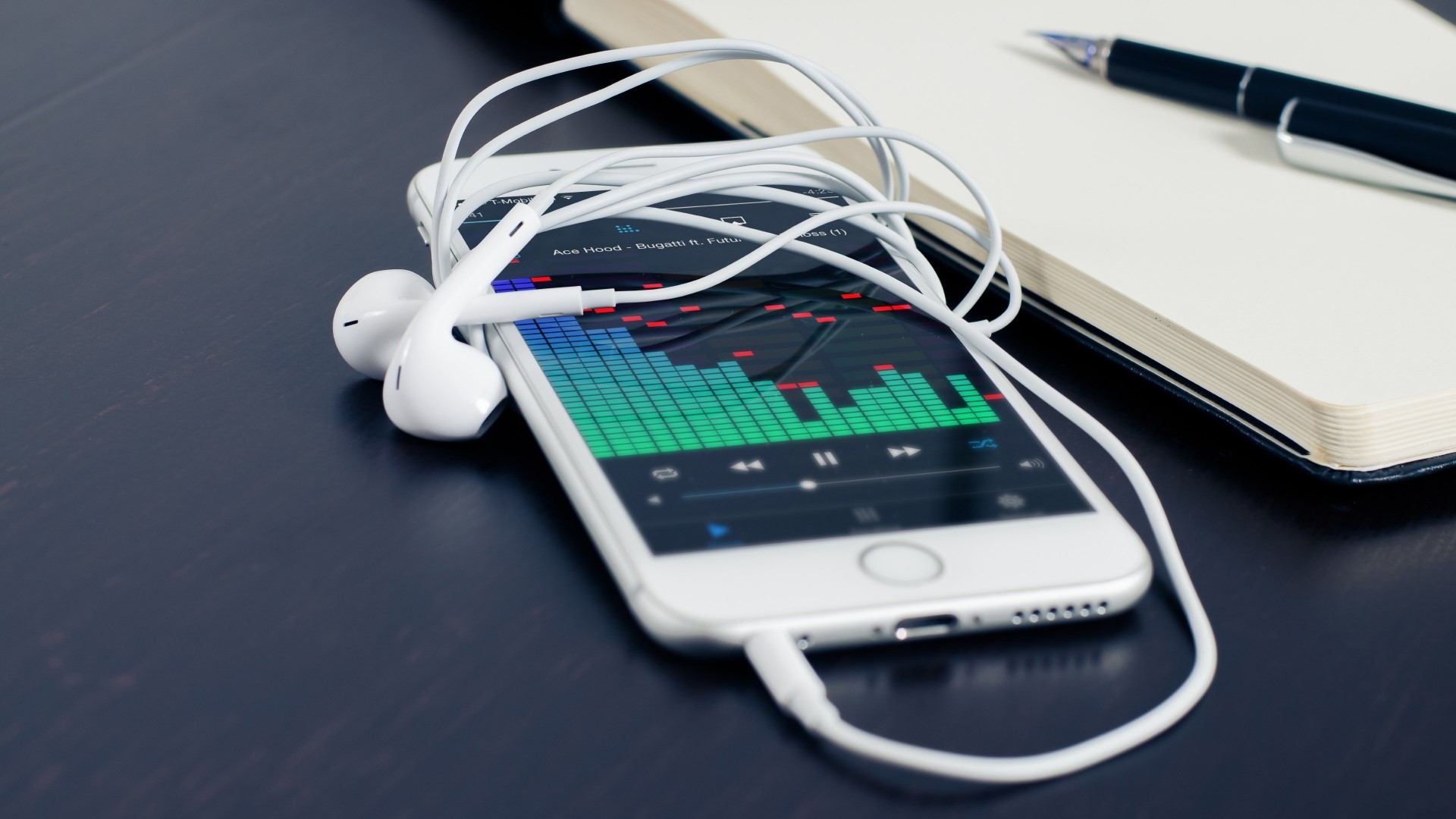 iPhone 6 with headphones and notebook HD Wallpaper