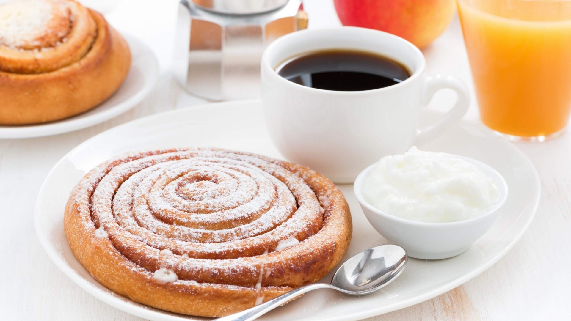 Breakfast with cinnamon roll, coffee, yogurt, and juice HD Wallpaper