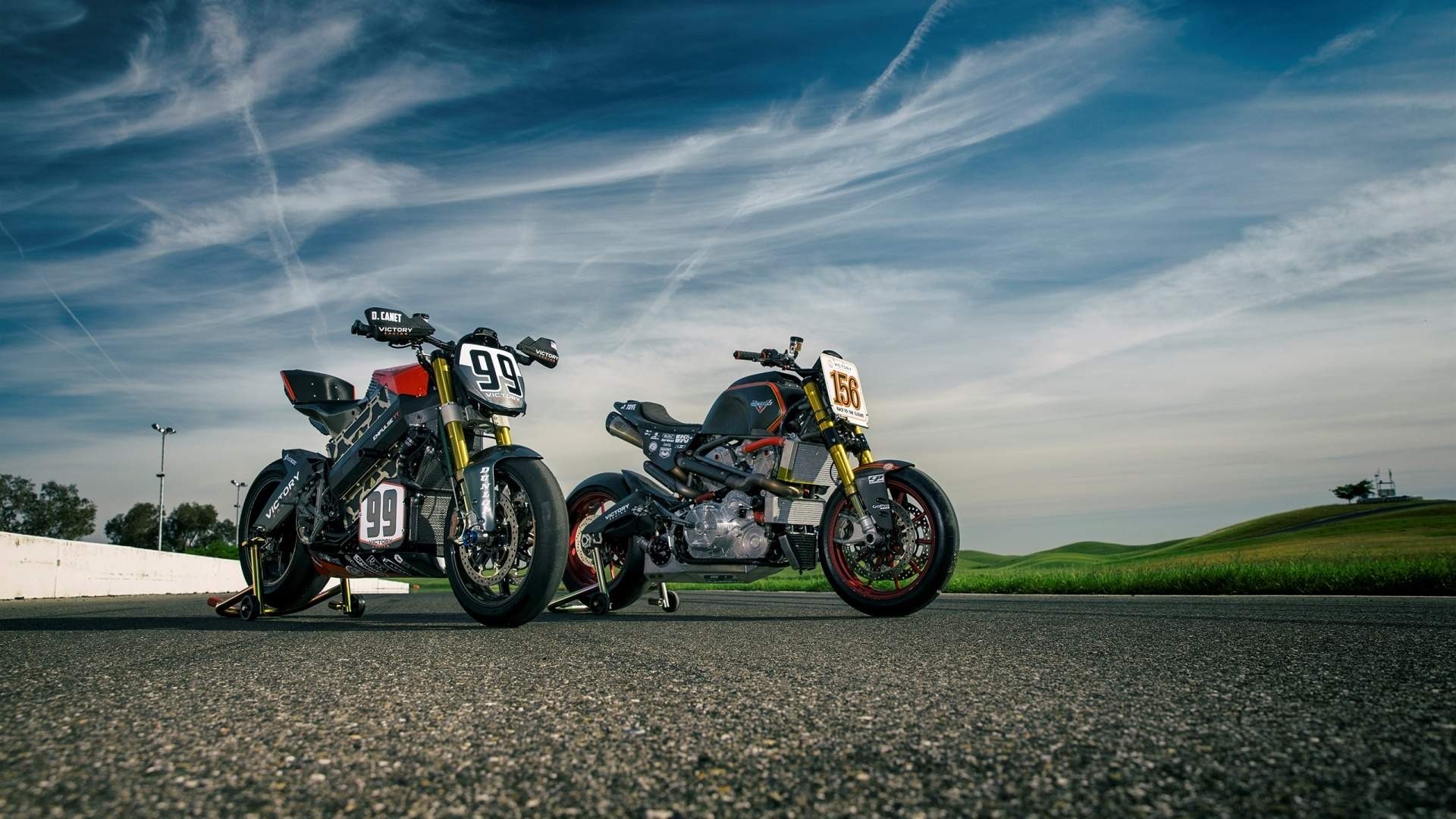 Two race motorcycles on a track HD Wallpaper