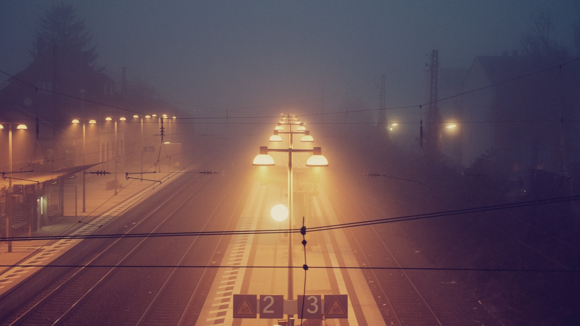 Train station at night with fog and lights HD Wallpaper