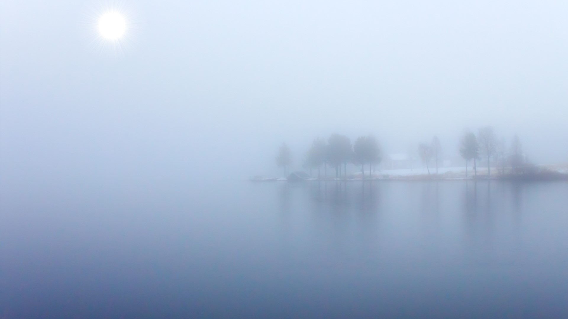 Foggy blue lake with trees and sun HD Wallpaper