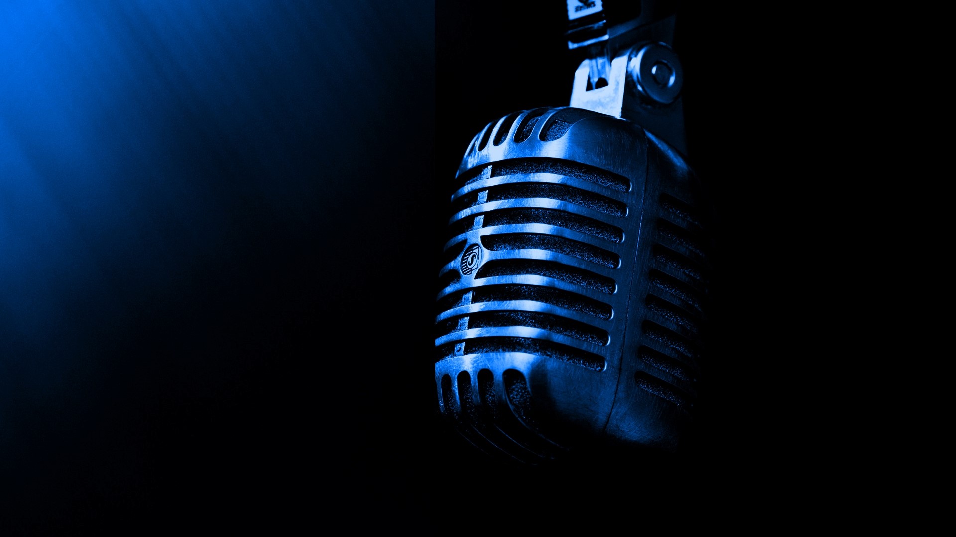 Blue vintage microphone with spotlight HD Wallpaper