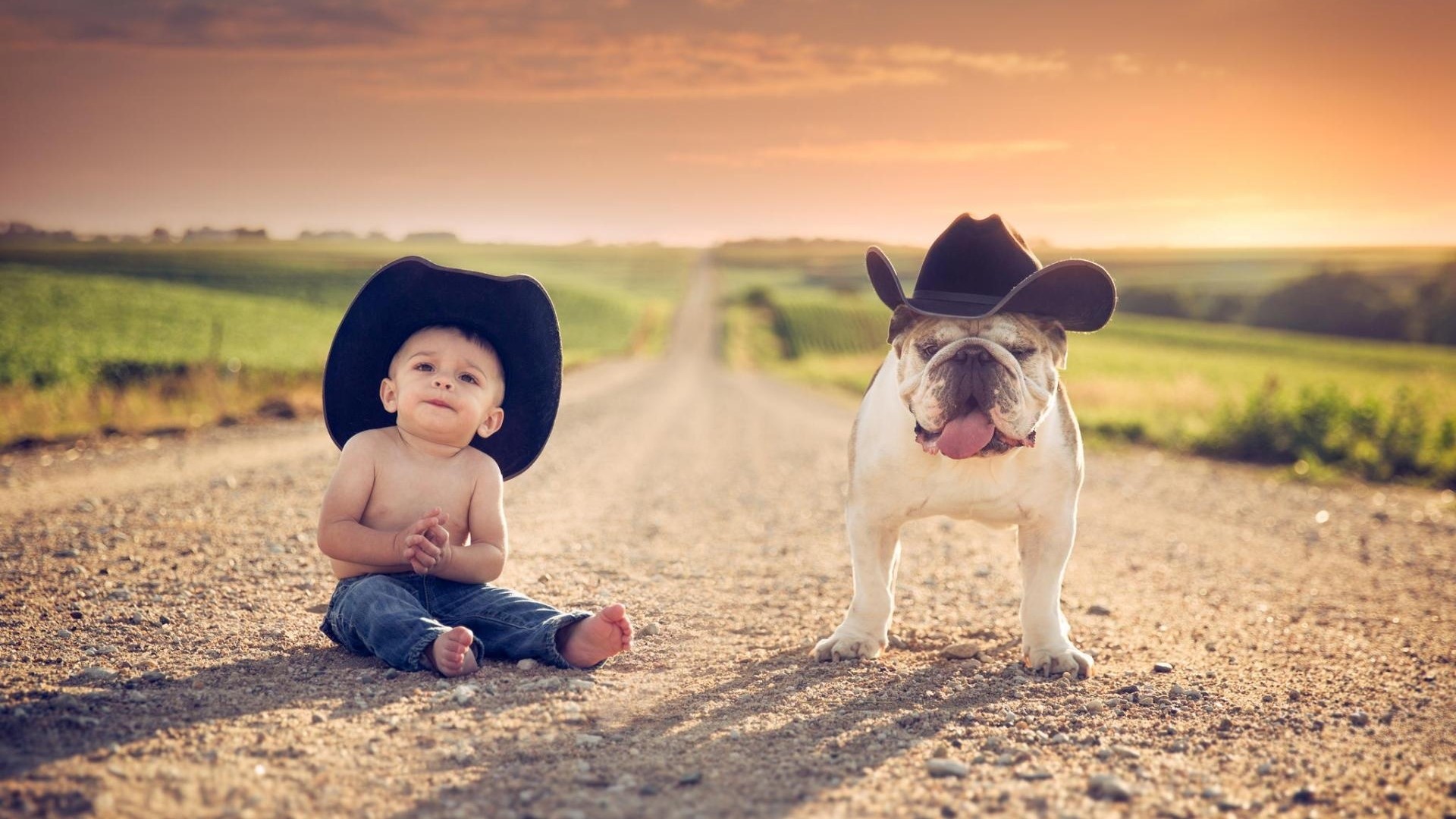 Baby and Bulldog Wearing Cowboy Hats on a Dirt Road HD Wallpaper