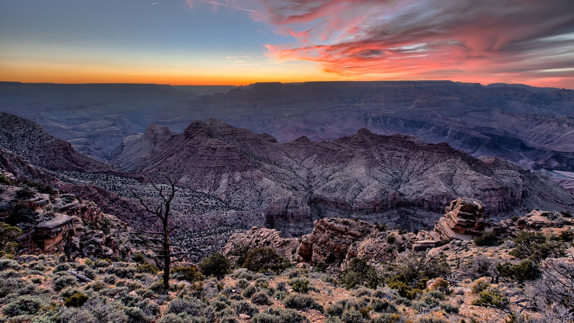 Grand Canyon at sunset with colorful clouds HD Wallpaper