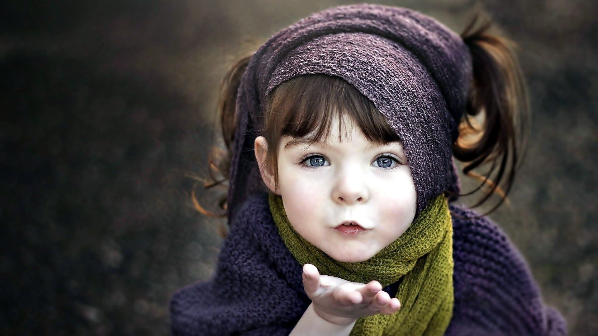 Cute girl blowing an air kiss HD Wallpaper