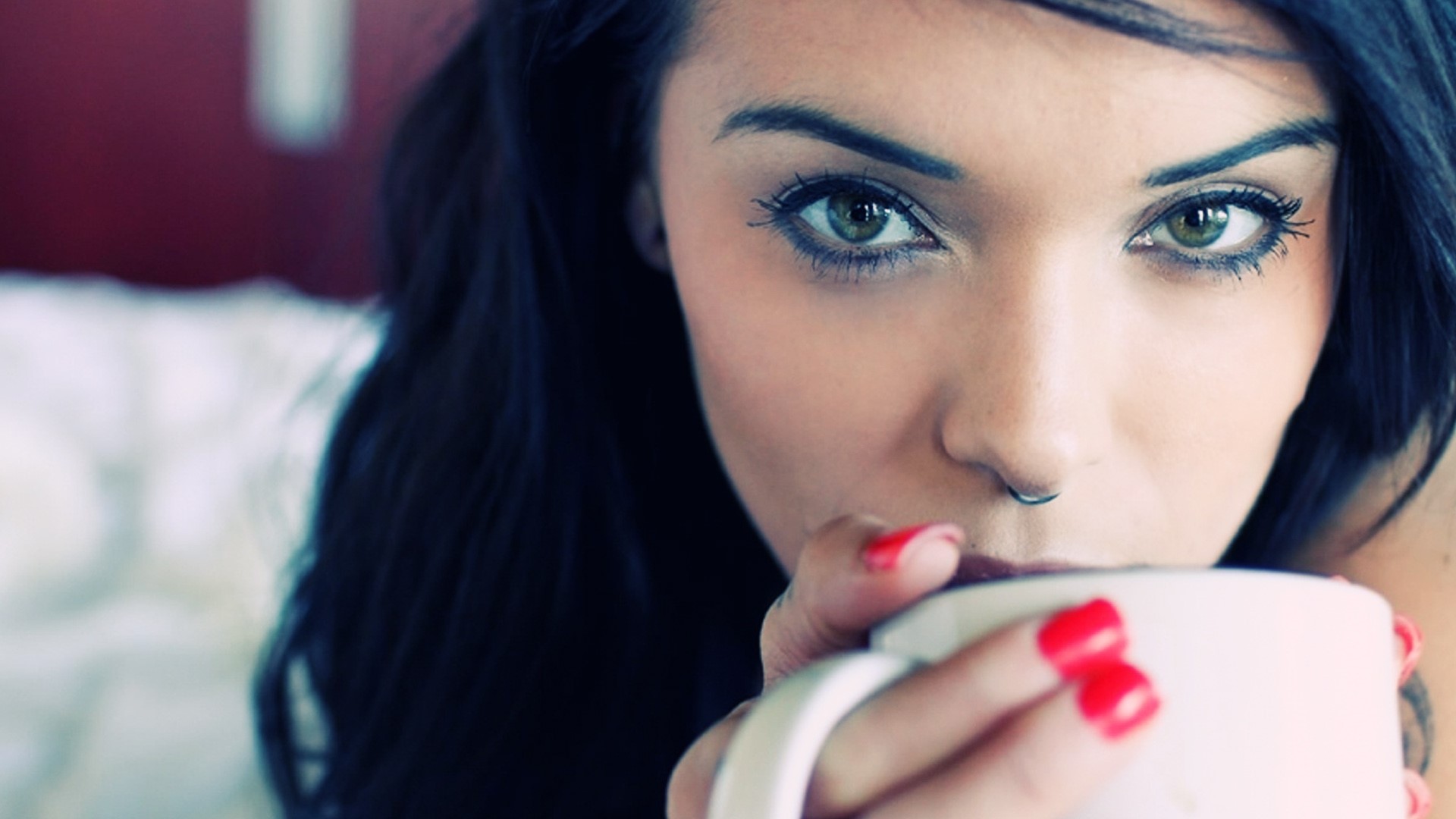 Brunette woman with nose piercing drinking coffee HD Wallpaper