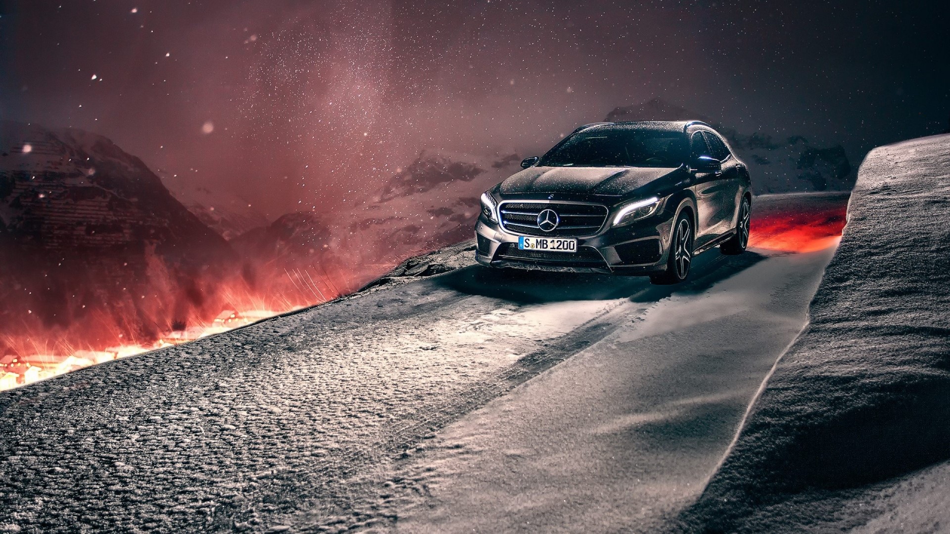 Mercedes-Benz GLA driving on a snowy mountain road HD Wallpaper