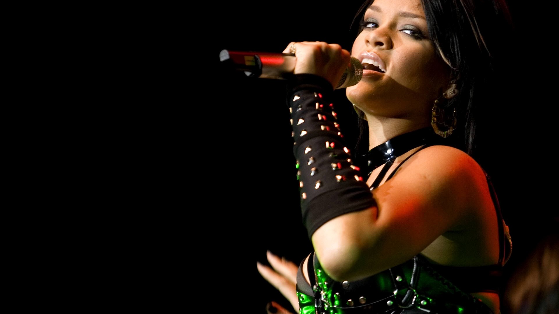 Rihanna singing on stage HD Wallpaper
