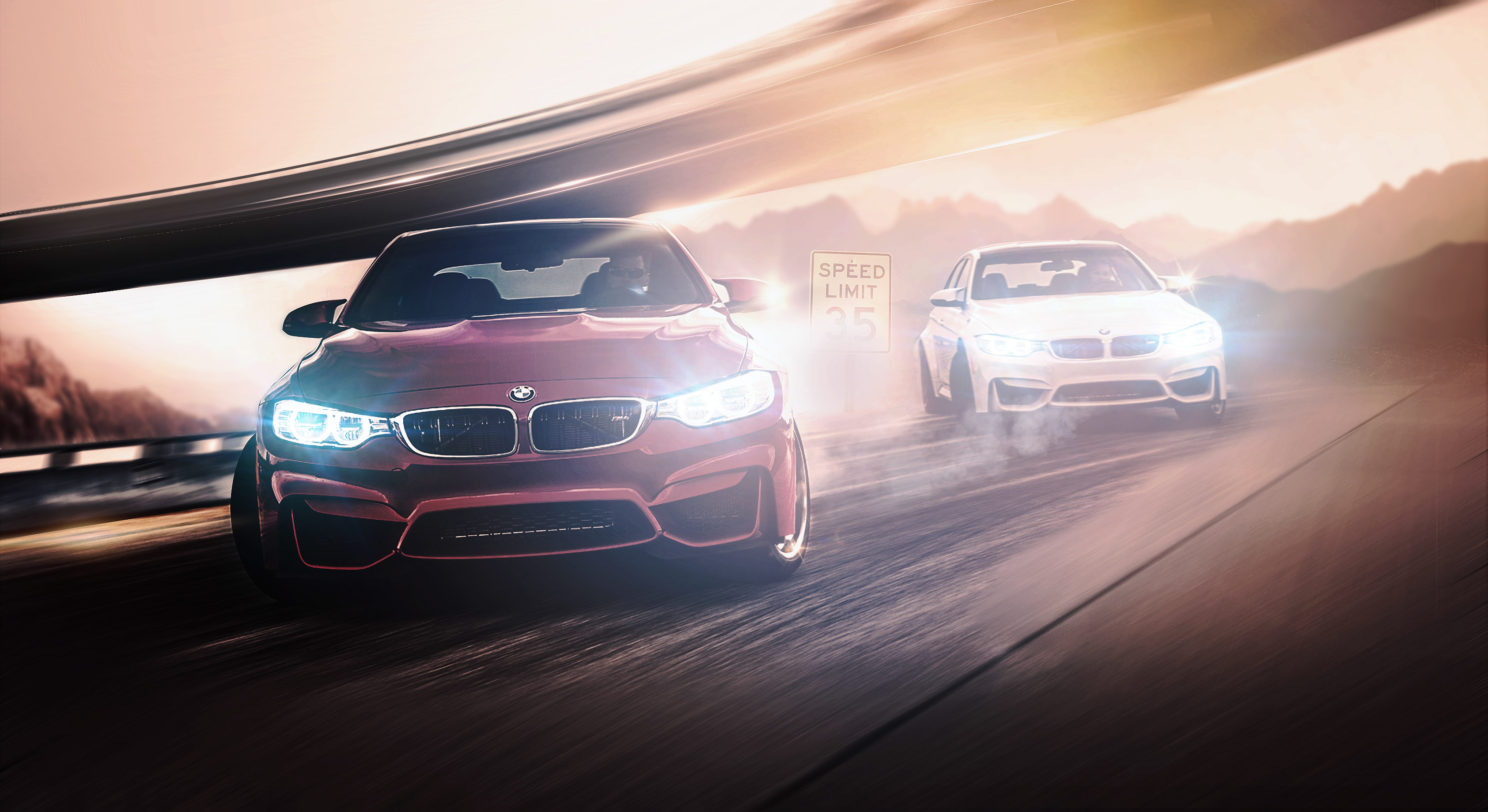 Two BMW M cars racing on a highway HD Wallpaper