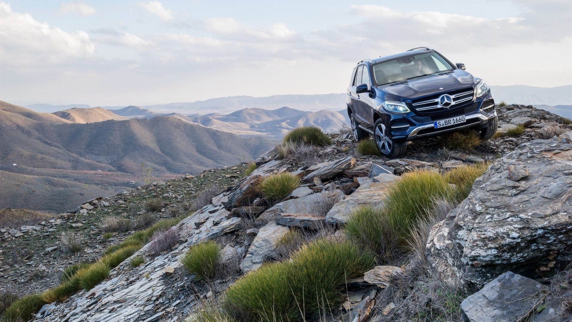 Mercedes-Benz SUV on rocky terrain HD Wallpaper
