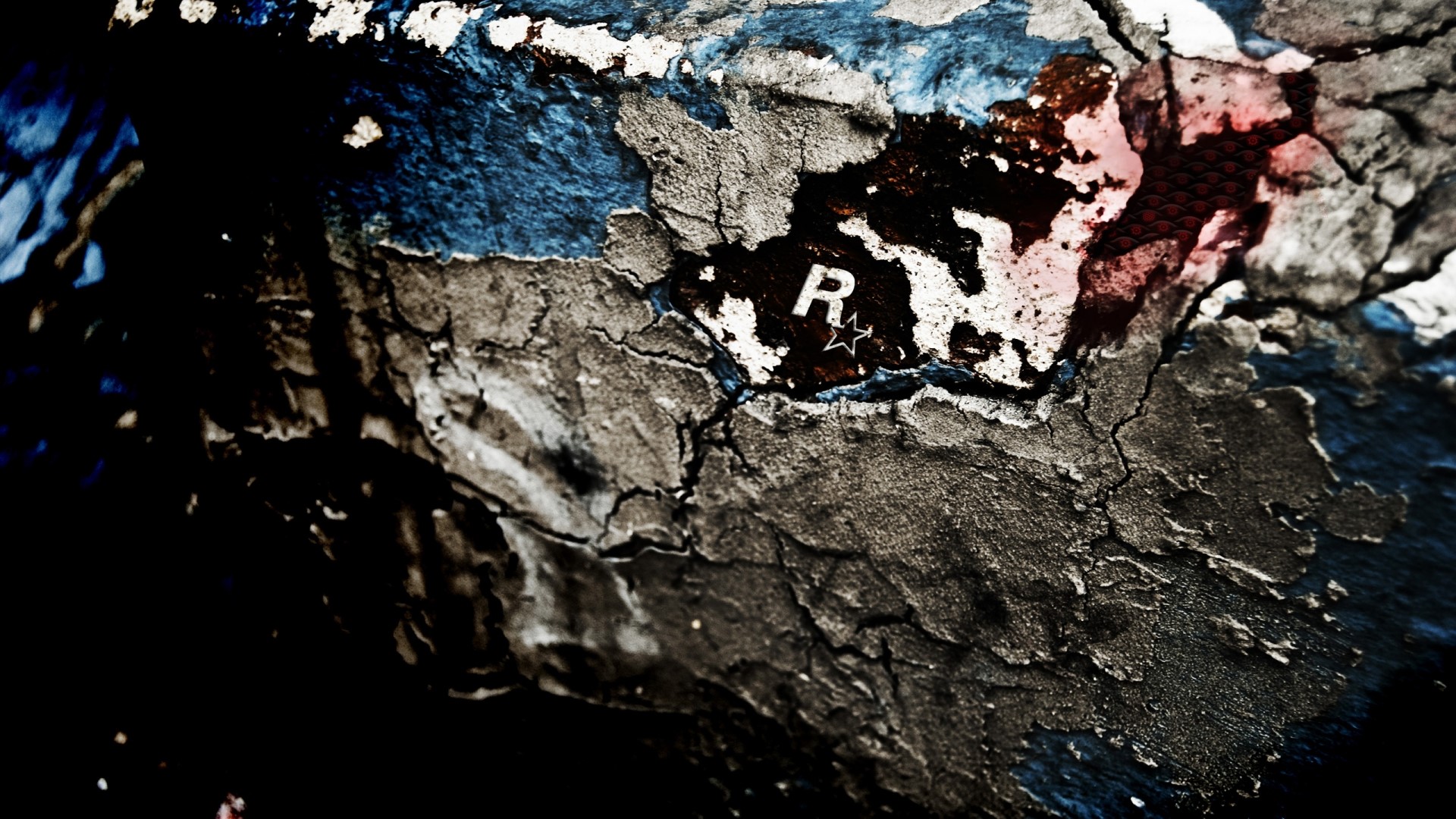 Rockstar Games logo on cracked surface HD Wallpaper