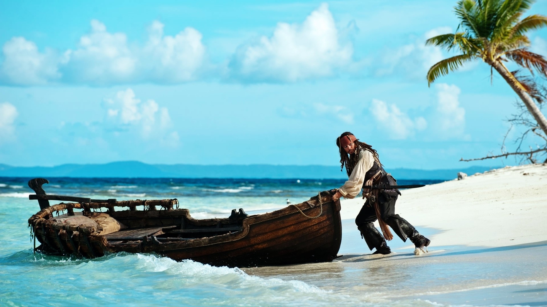 Jack Sparrow pushing a boat on a beach HD Wallpaper