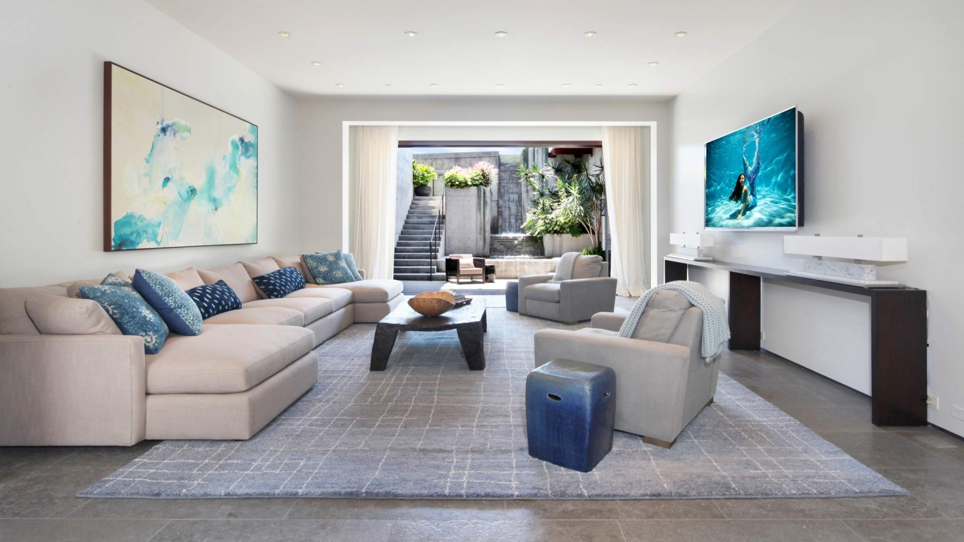 Living room with sectional sofa and outdoor view HD Wallpaper