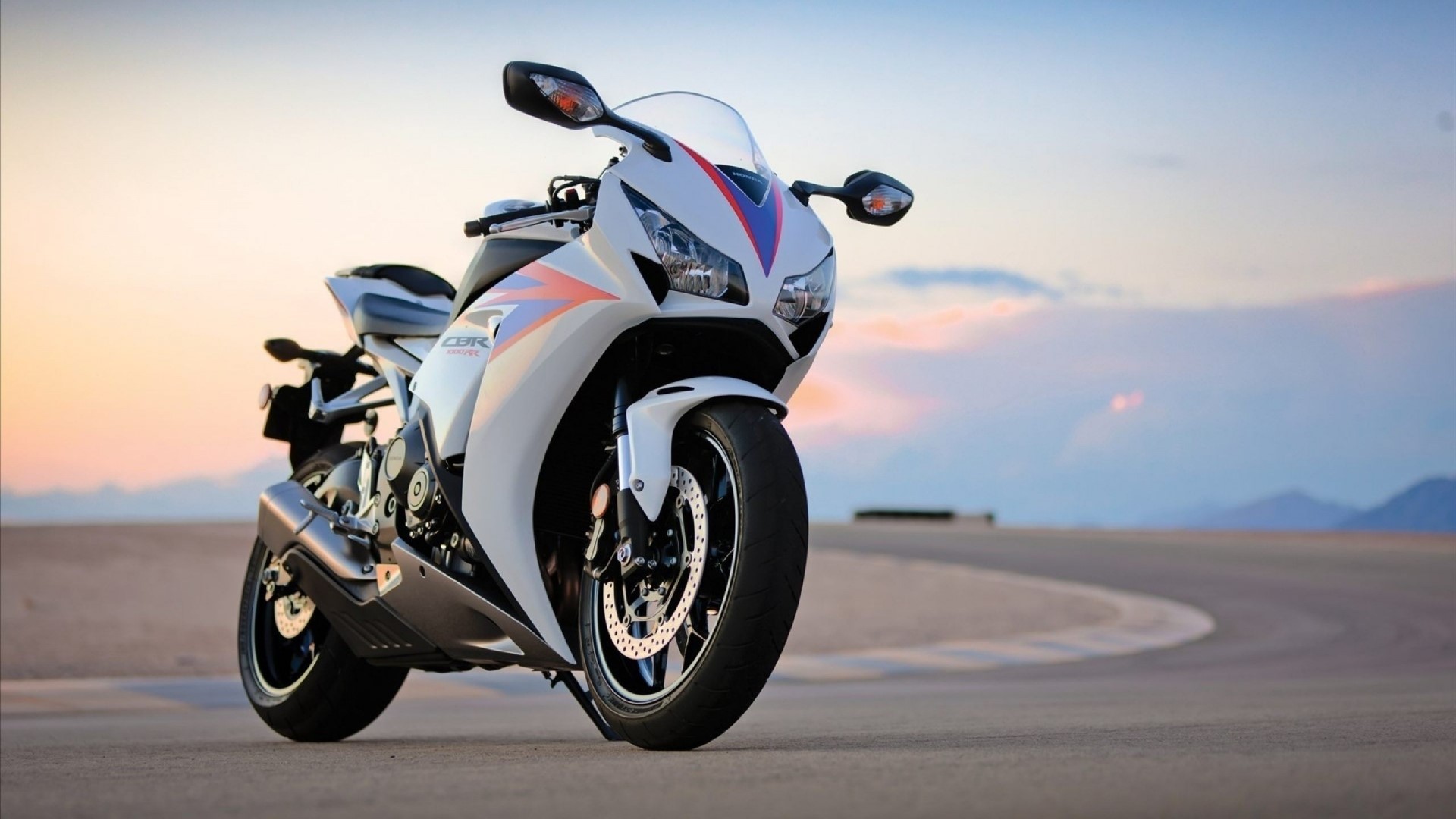 White Honda CBR motorcycle on a road HD Wallpaper