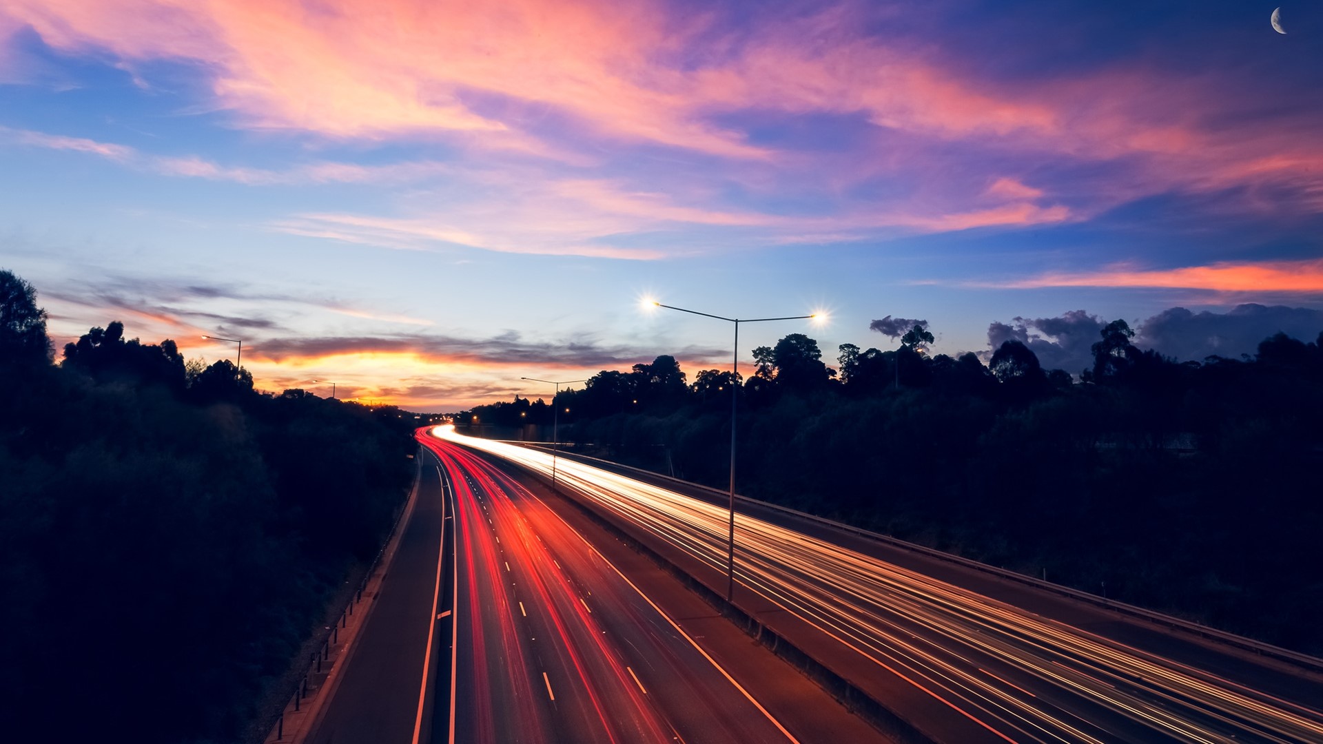 Highway at Dusk with Light Trails and Moon HD Wallpaper