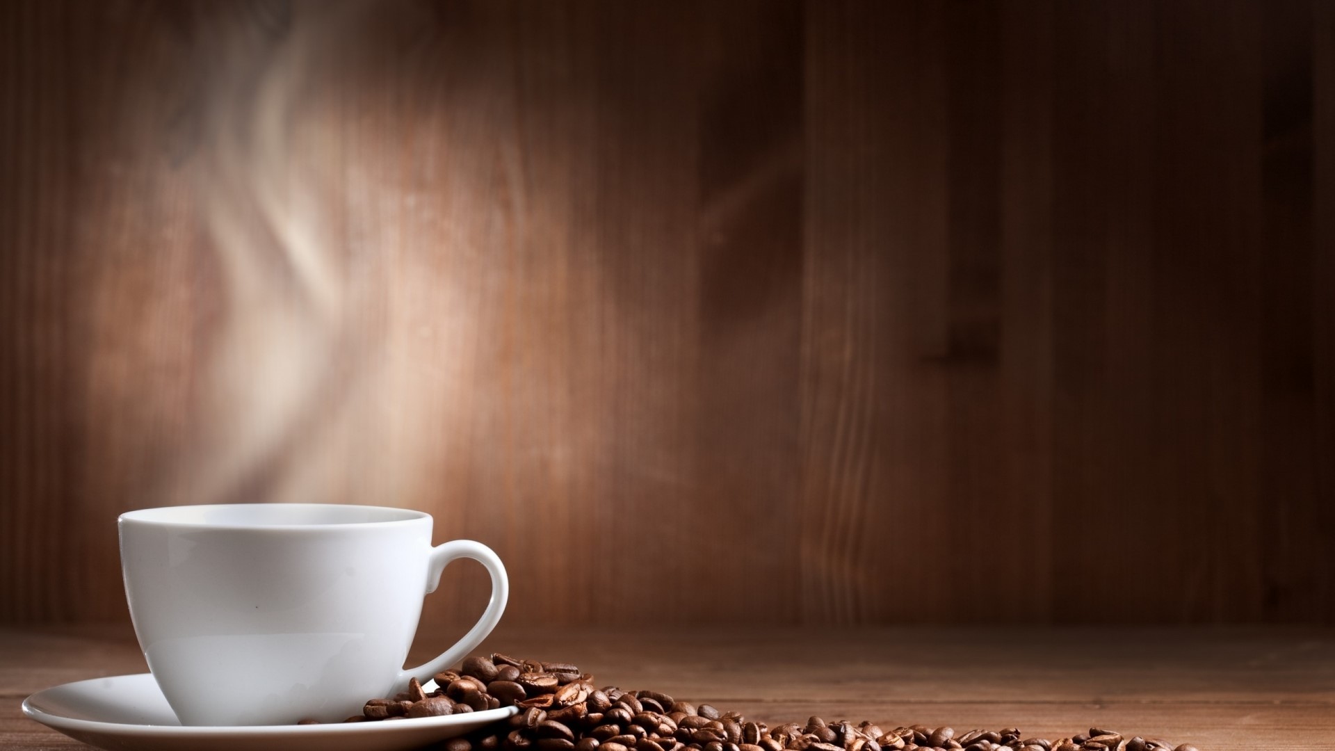 Steaming Coffee Cup with Beans HD Wallpaper
