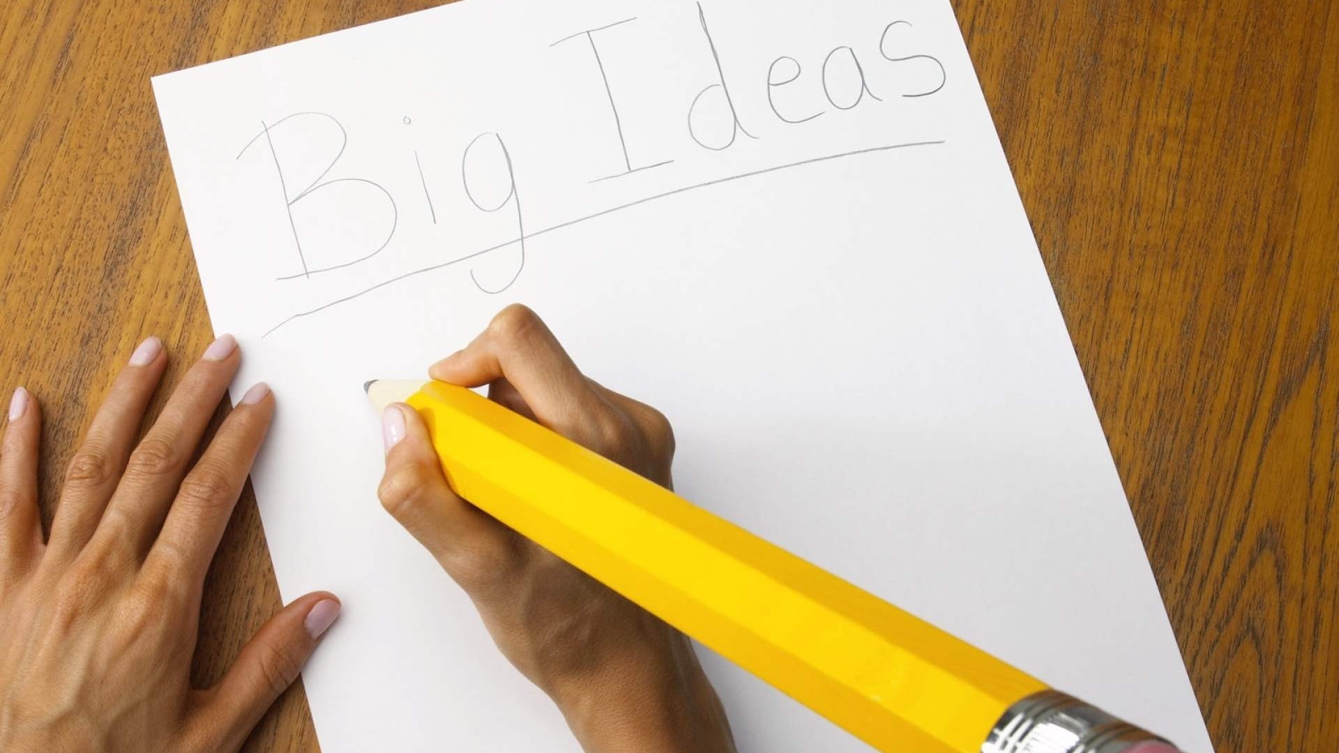 Big Ideas written on paper with a giant pencil HD Wallpaper