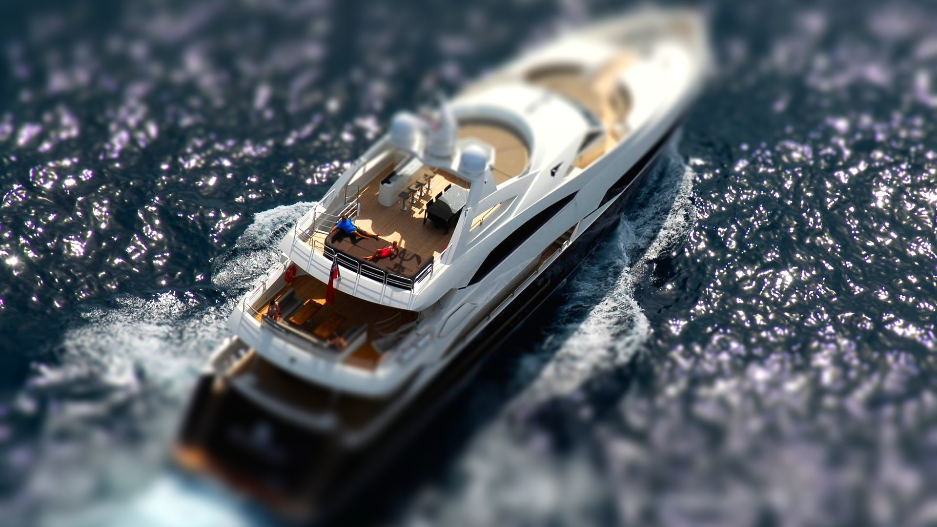 Aerial view of a luxury yacht on the water HD Wallpaper