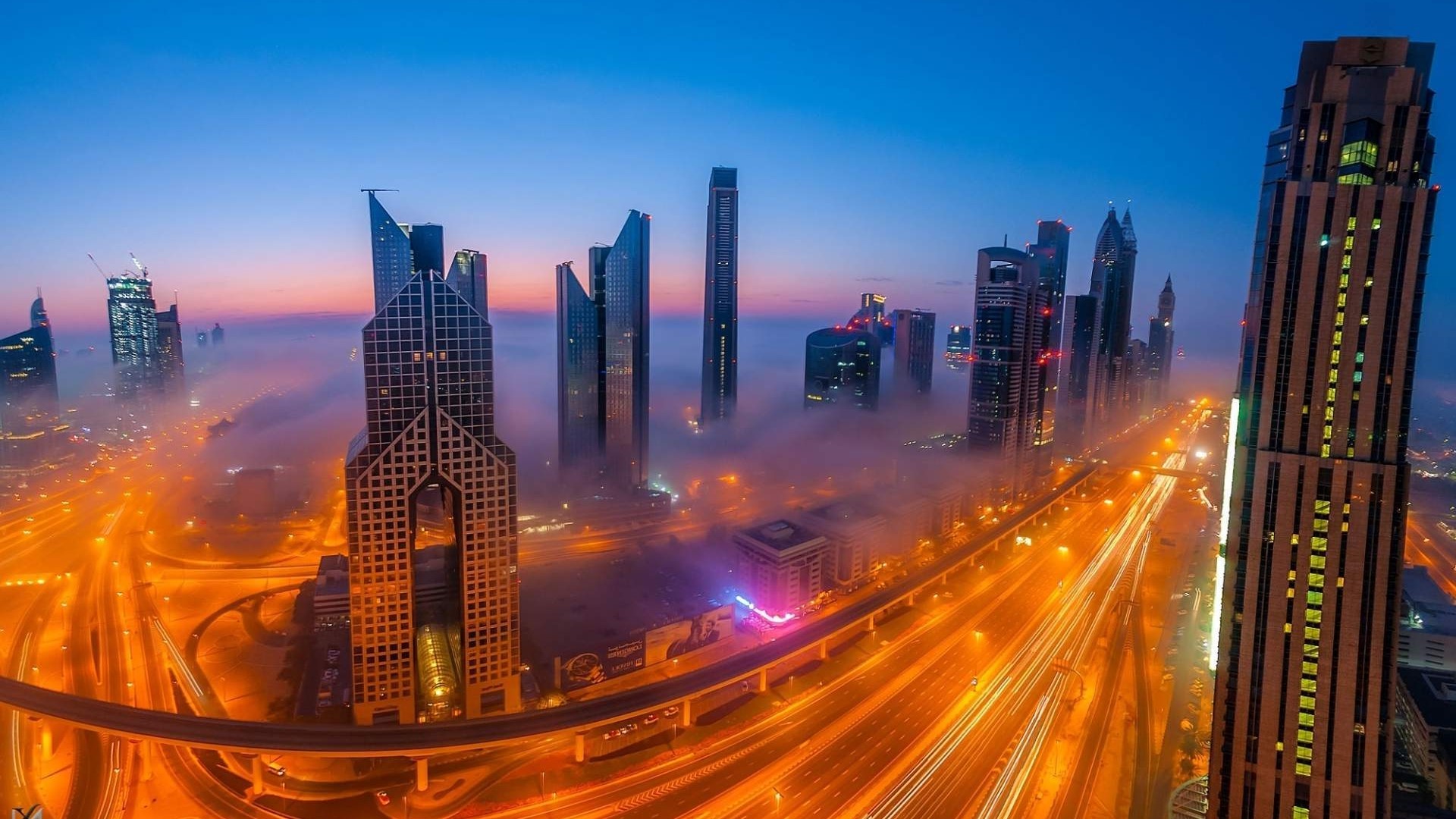 Dubai skyscrapers shrouded in fog at dawn HD Wallpaper