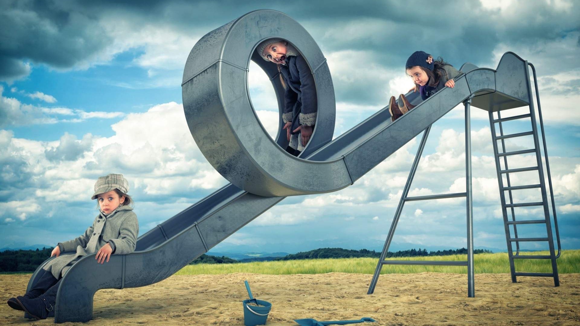Children on a playground slide HD Wallpaper