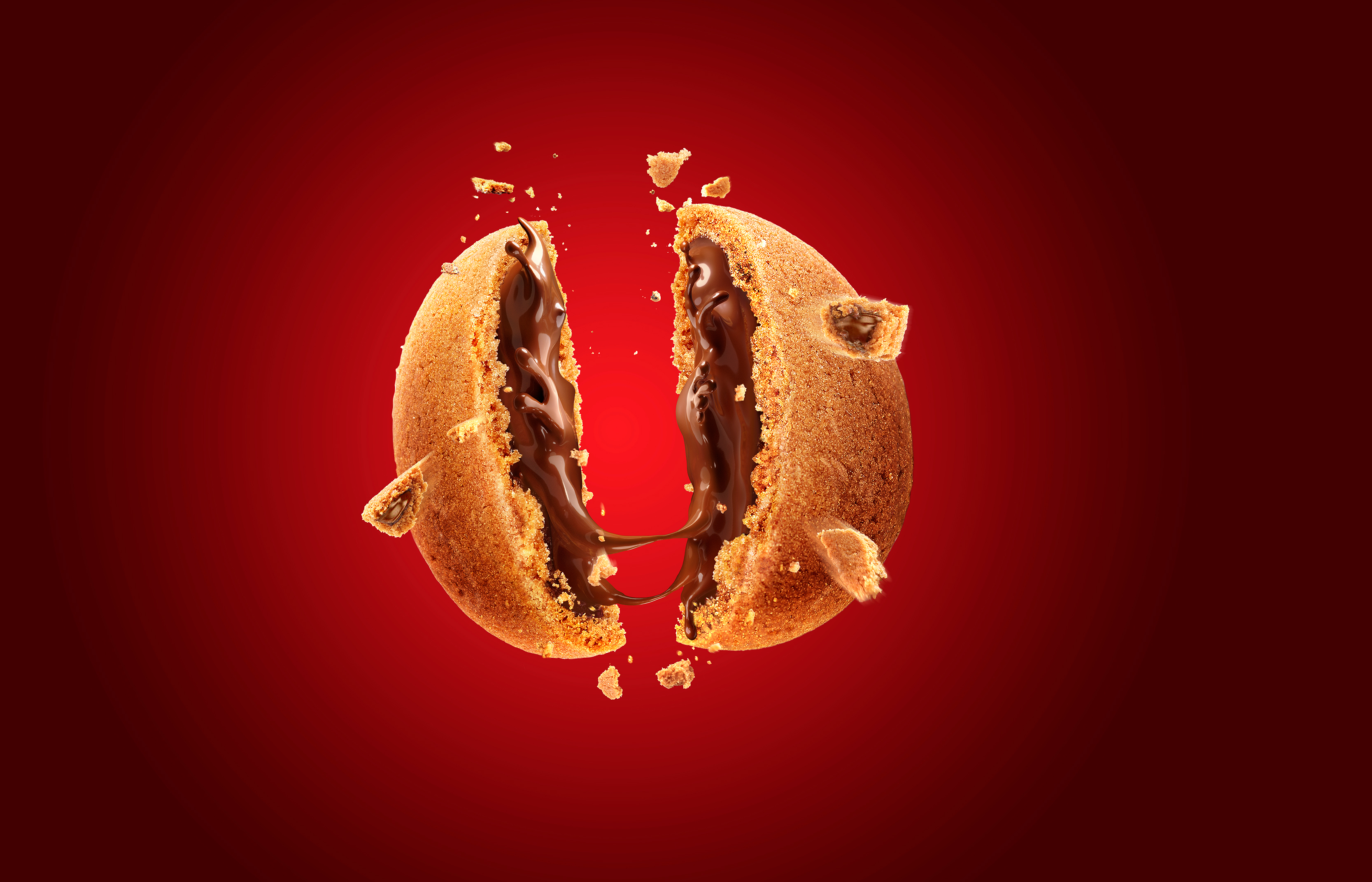 Chocolate cookie broken in half with molten chocolate HD Wallpaper