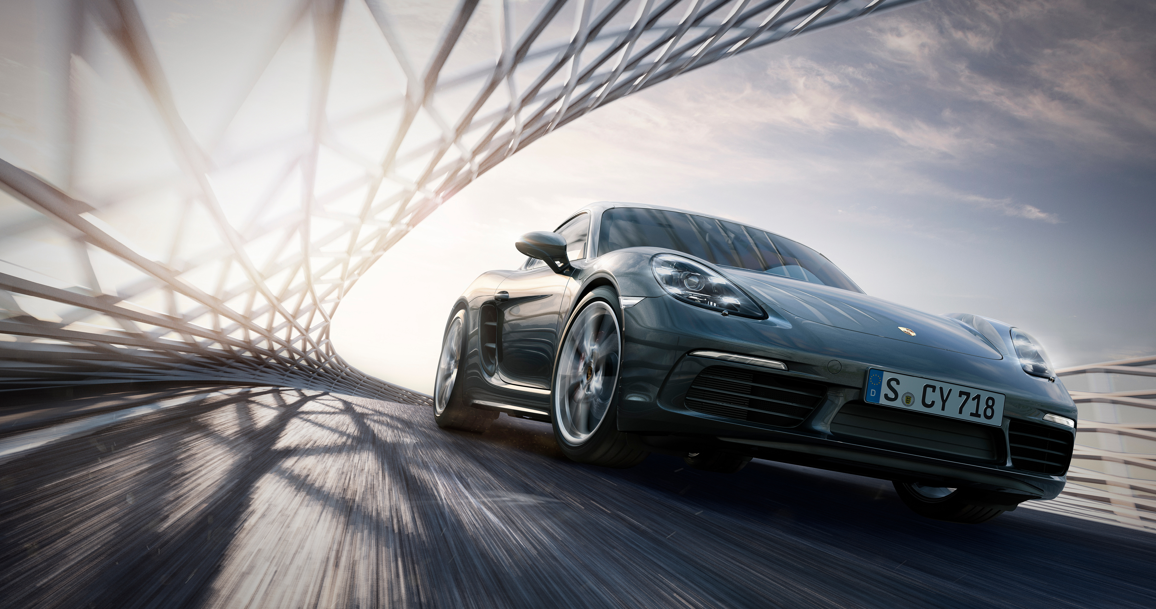 4K Porsche Cayman S driving on a road HD Wallpaper