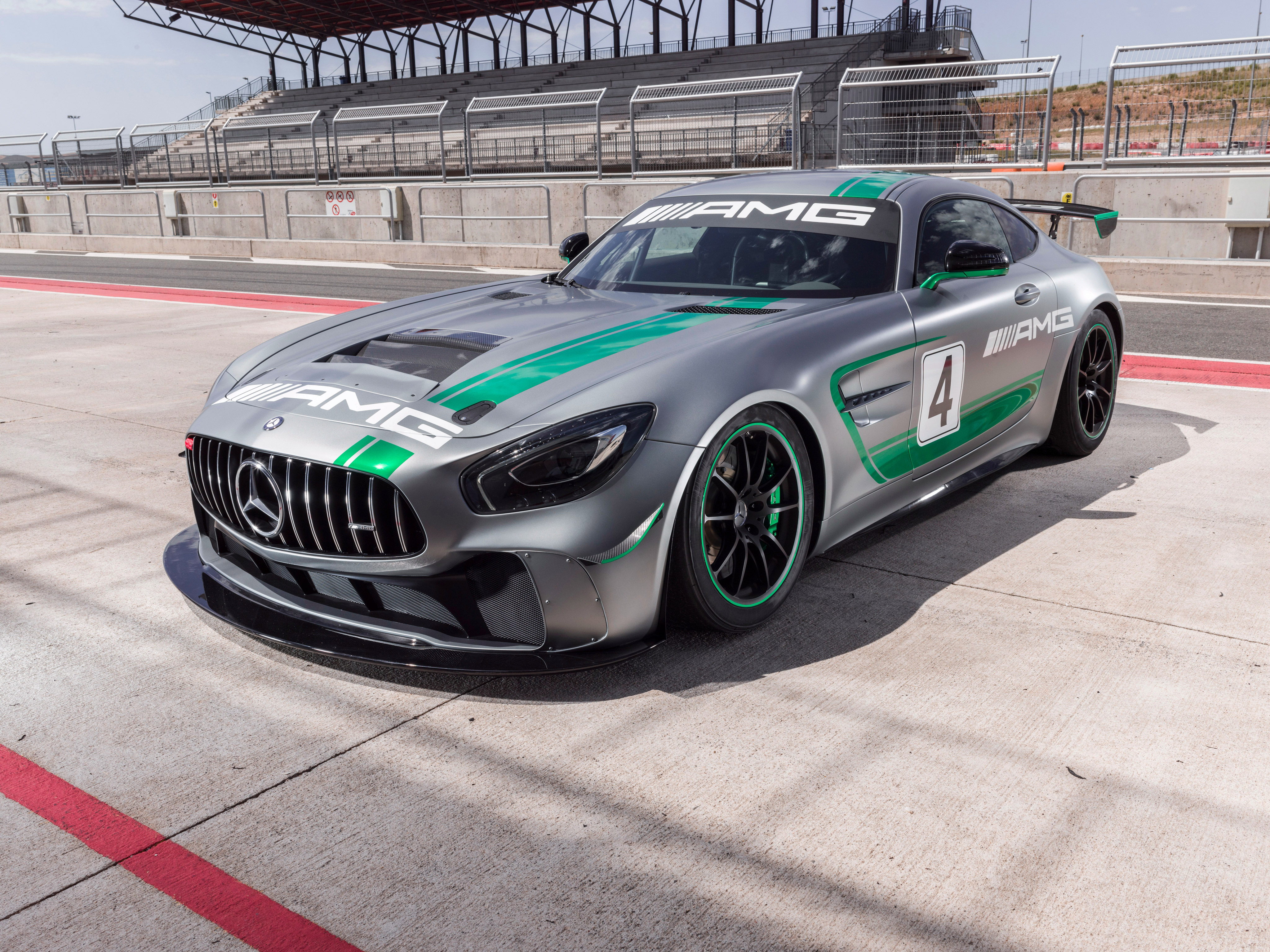Mercedes-AMG GT4 race car with green stripes HD Wallpaper