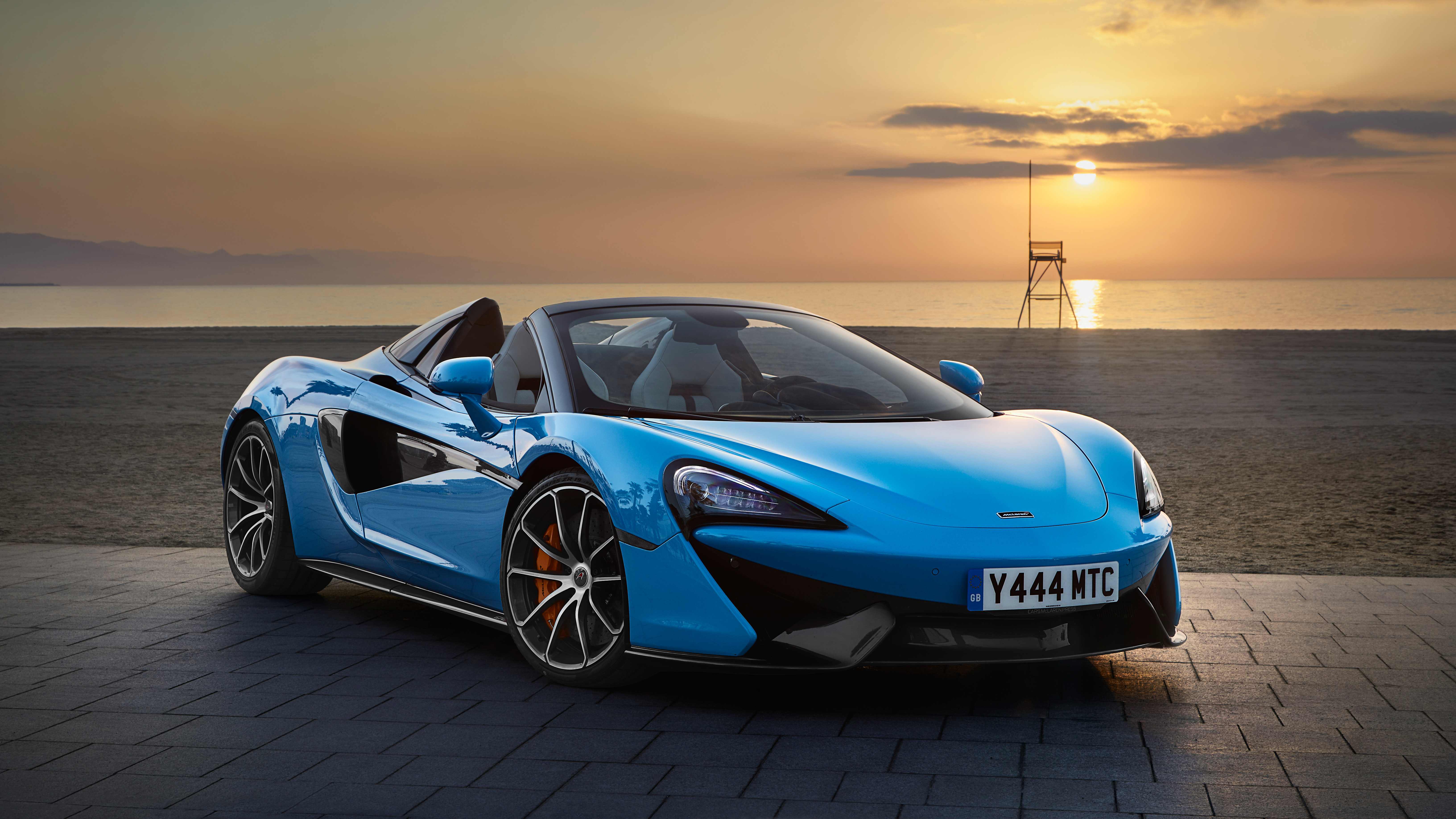 Blue McLaren 570S Spider convertible car on beach at sunset 4K HD Wallpaper