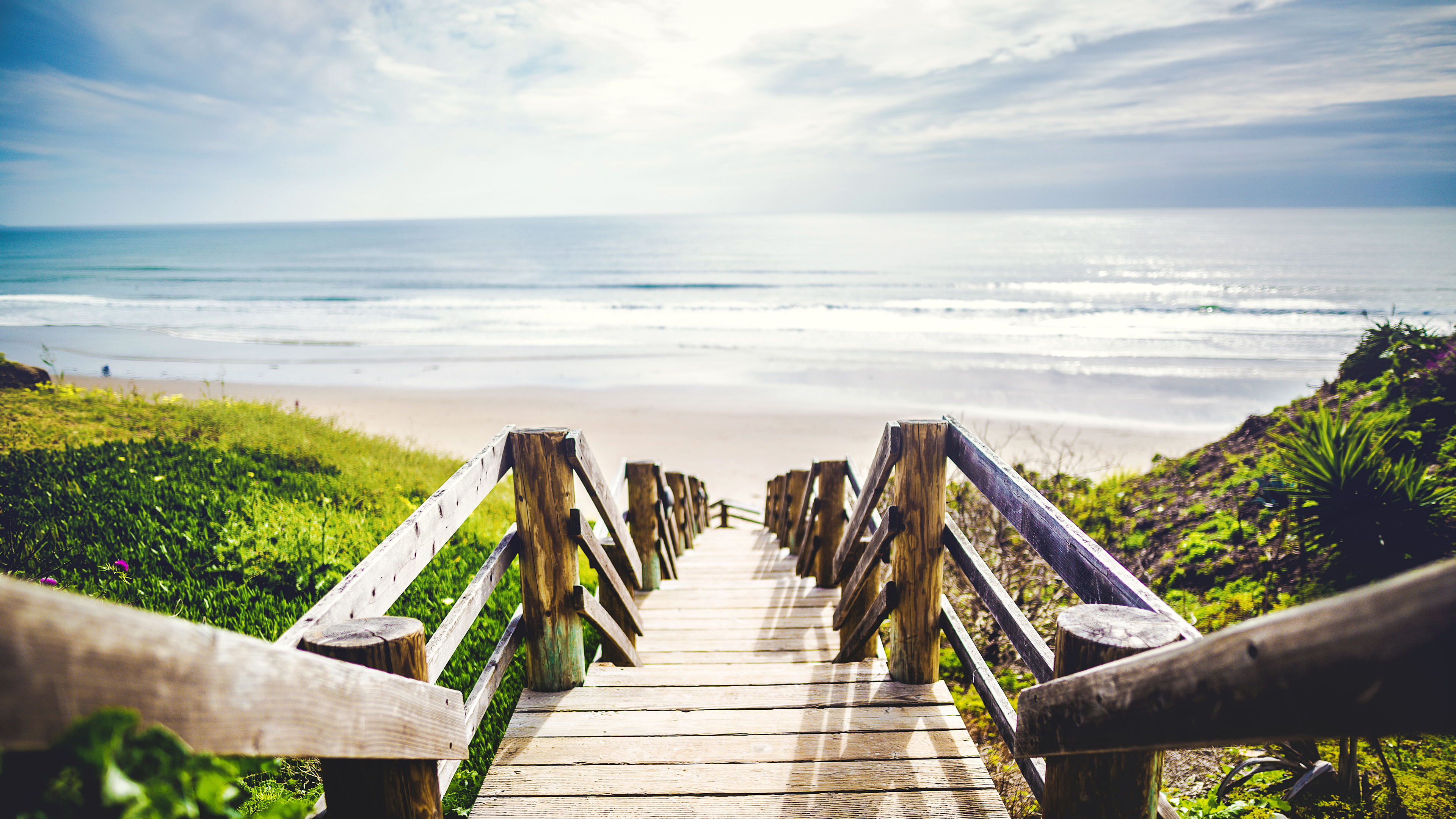 Wooden stairs leading to a beach HD Wallpaper