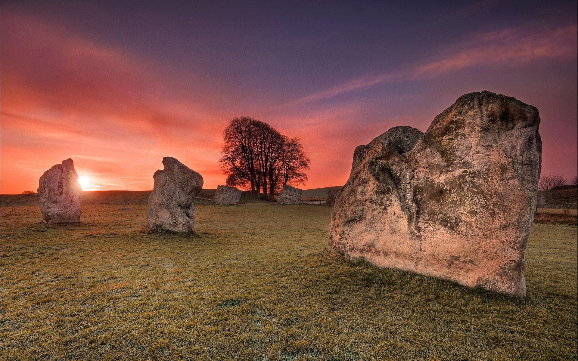 Standing stones at sunrise with dramatic sky HD Wallpaper